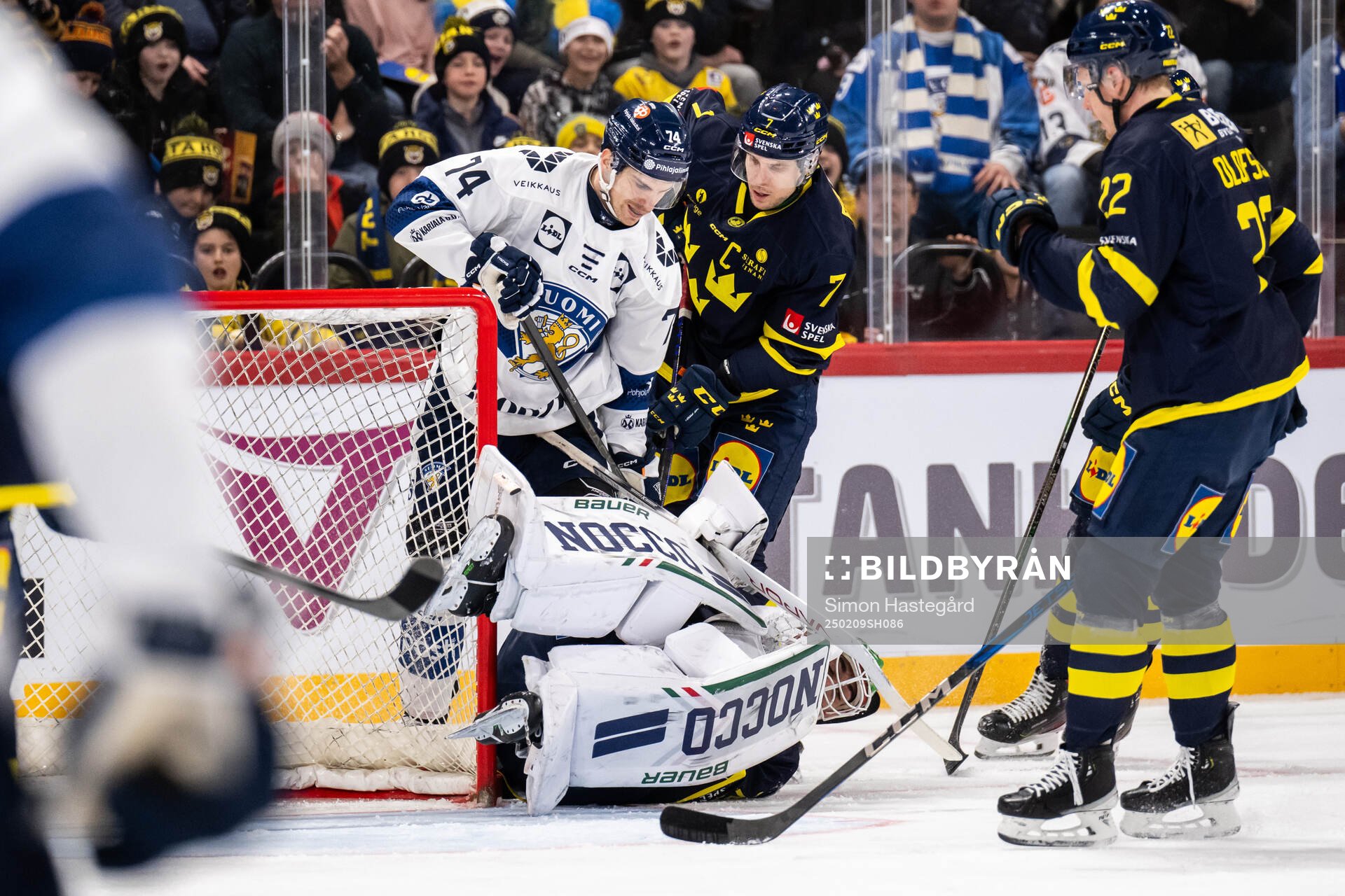 Atro Leppänen of Finland and goalkeeper Arvid Holm of