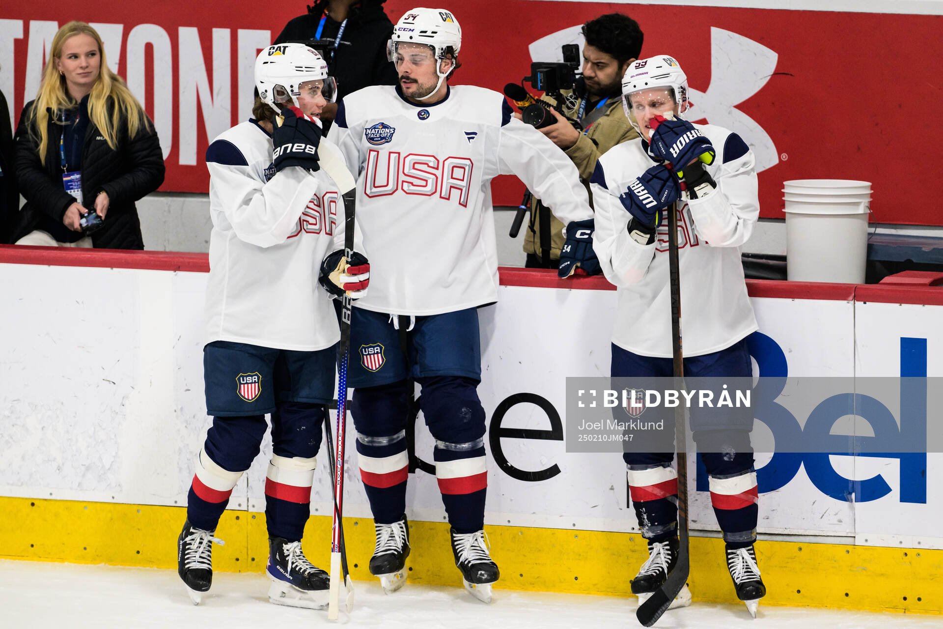 Jack Hughes, Auston Matthews and Jake Guentzel of USA at a