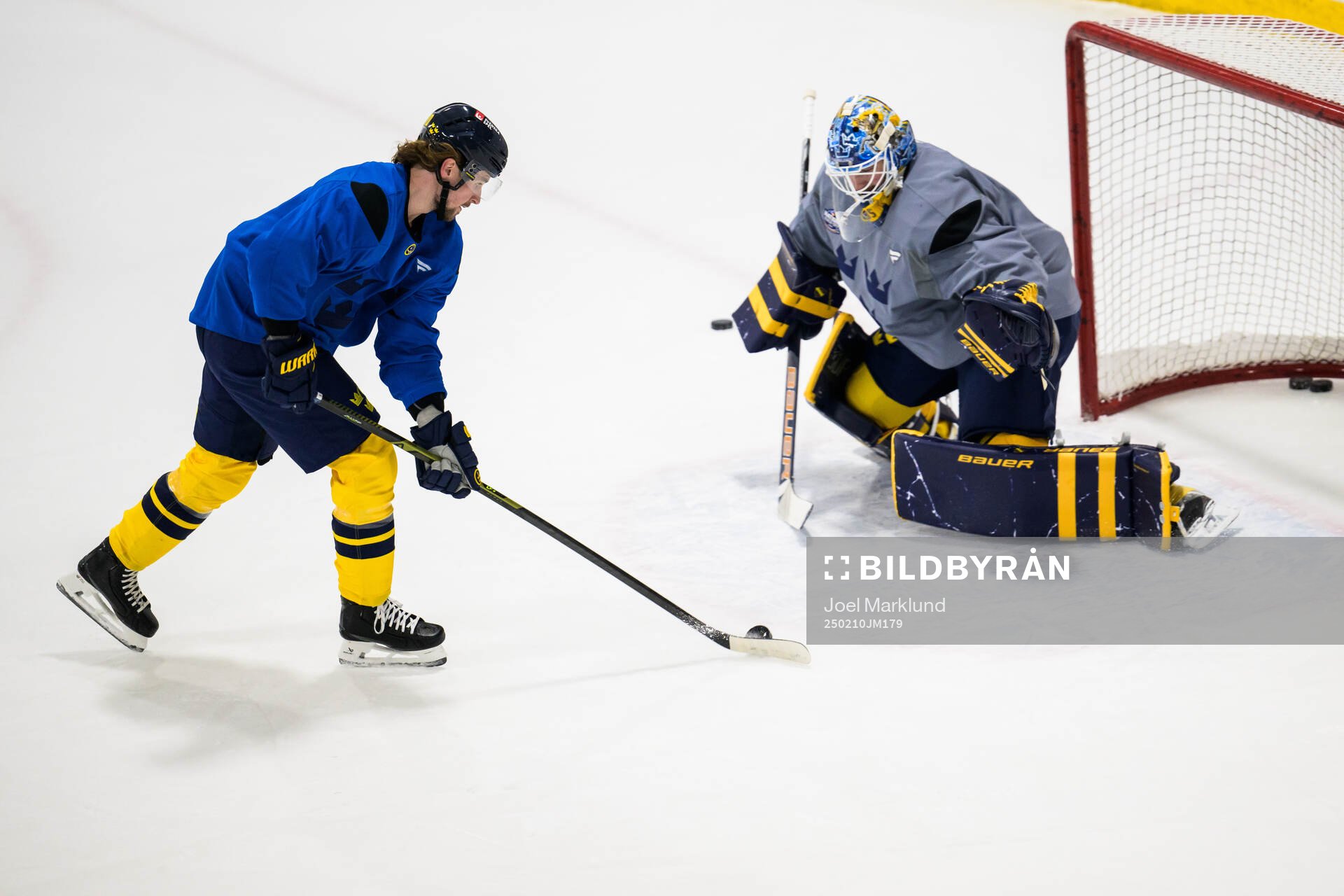 Adrian Kempe and goaltender Linus Ullmark of Sweden at a