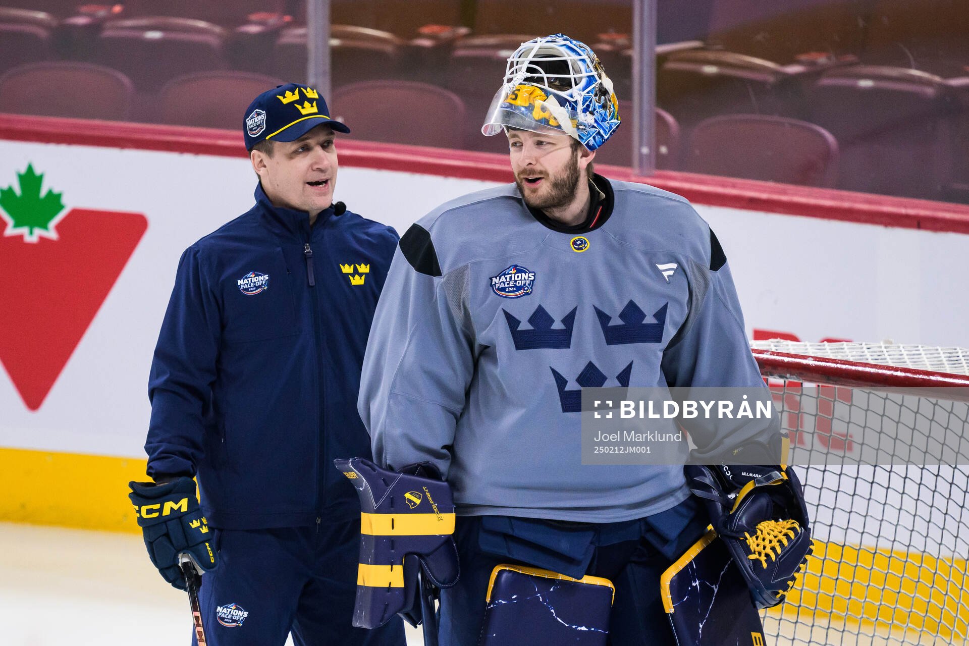 Head coach Sam Hallam and goaltender Linus Ullmark of
