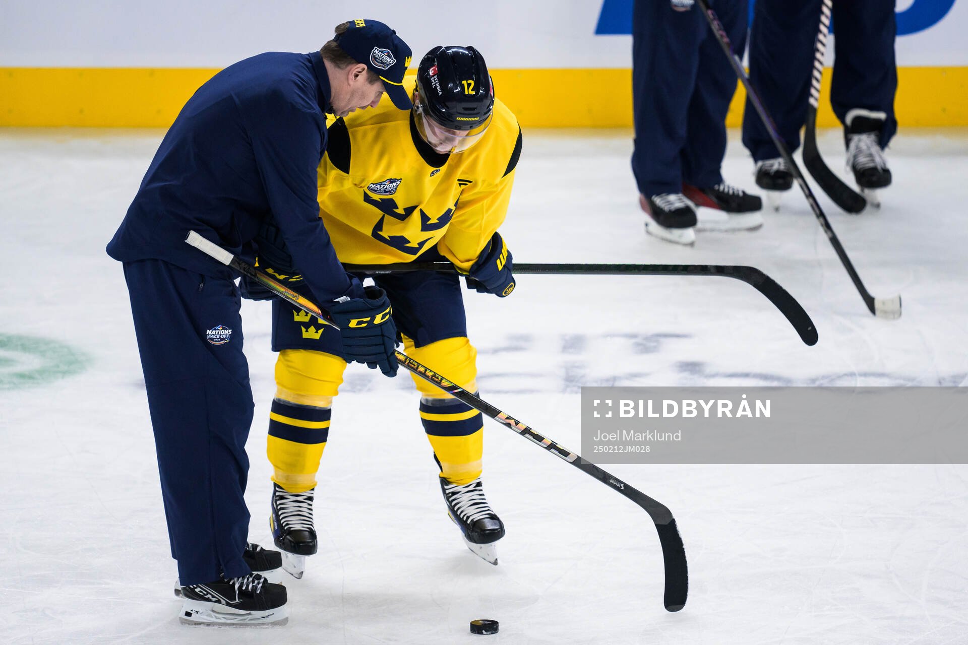 Assistant coach Stefan Klockare and Gustav Nyquist of