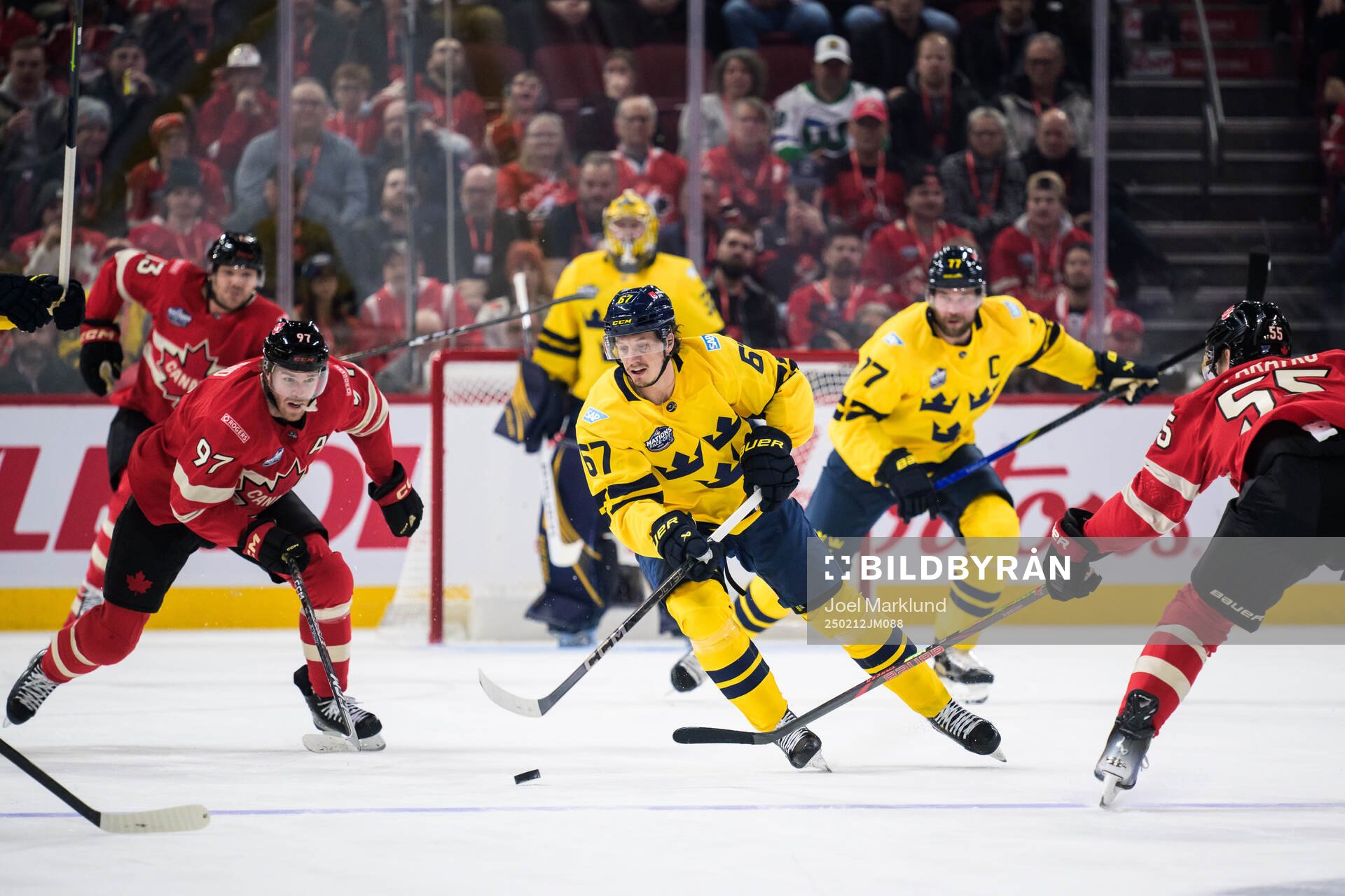 Connor McDavid and Colton Parayko of Canada are being