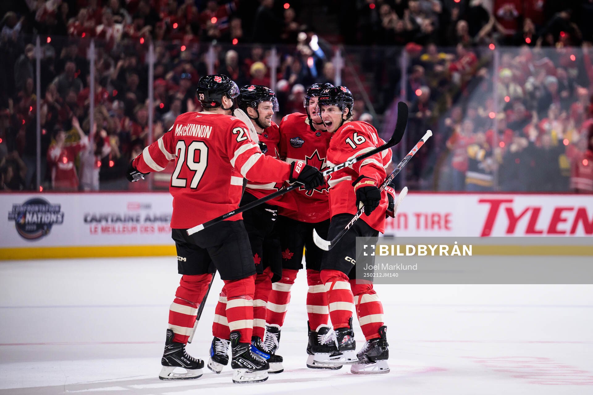 Mitch Marner of Canada celebrates with teammates