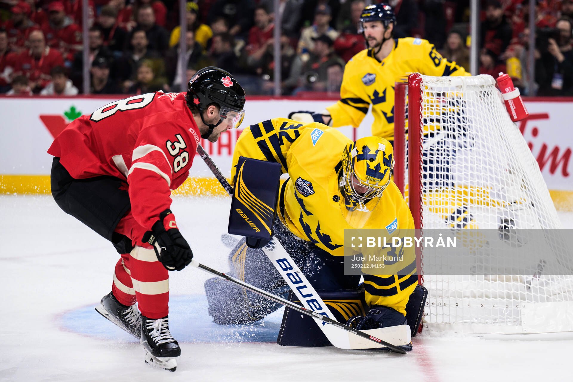 Brandon Hagel of Canada and goaltender Filip Gustavsson of