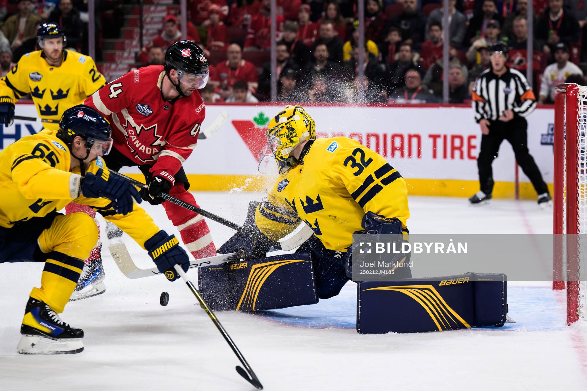 Josh Morrissey of Canada challenges Erik Karlsson and