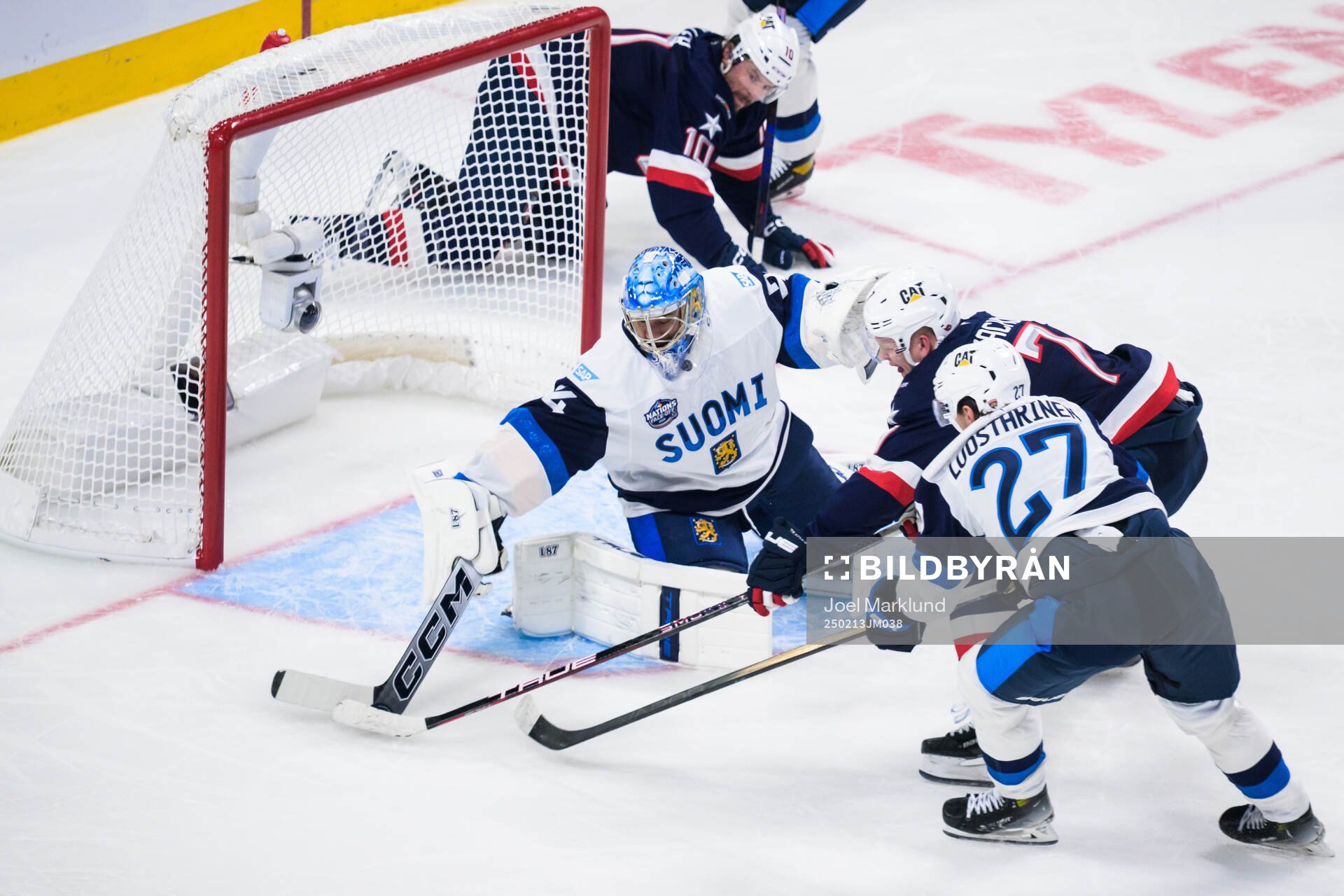 Goaltender Juuse Saros and Eetu Luostarinen of Finland are