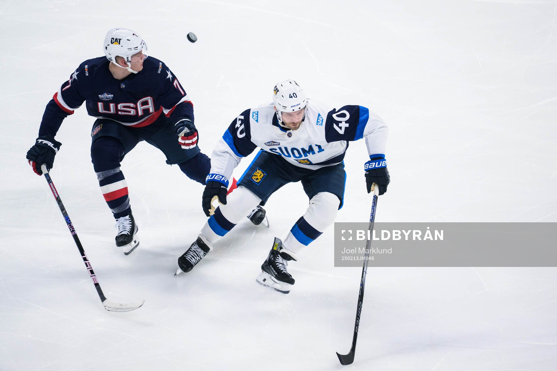 Brady Tkachuk of USA and Joel Armia of Finland