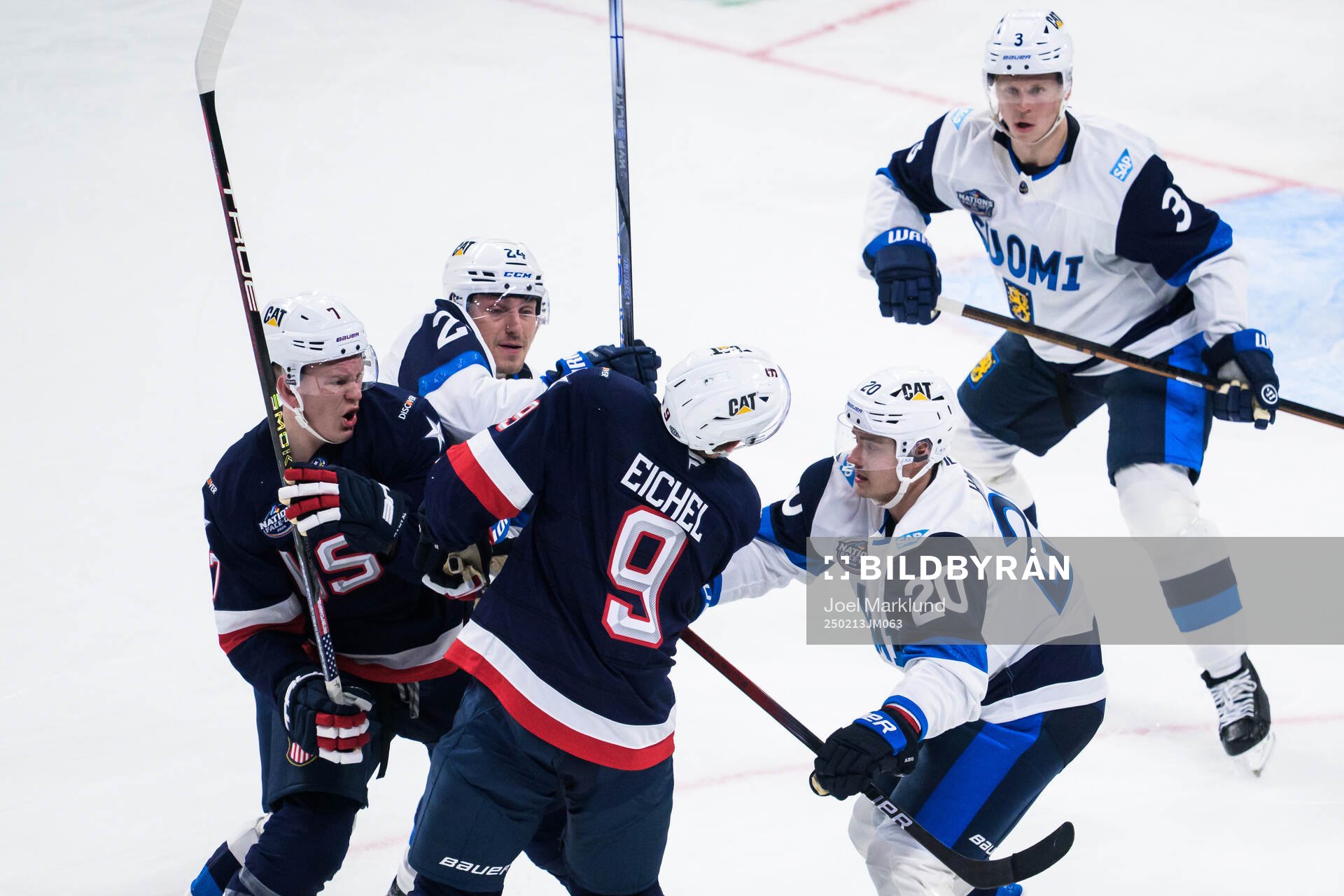 Brady Tkachuk and Jack Eichel of USA in action against