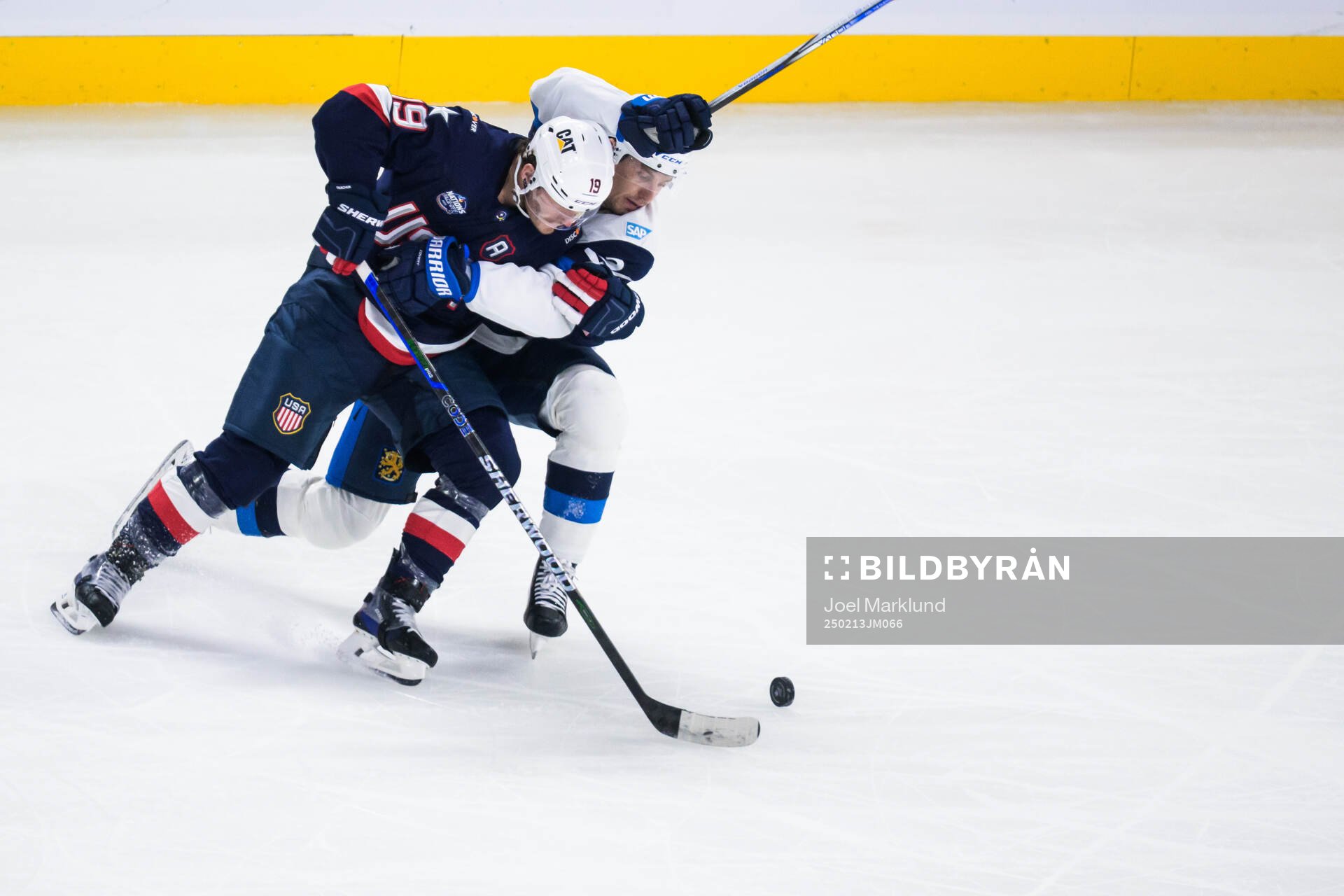 Matthew Tkachuk of USA and Roope Hintz of Finland