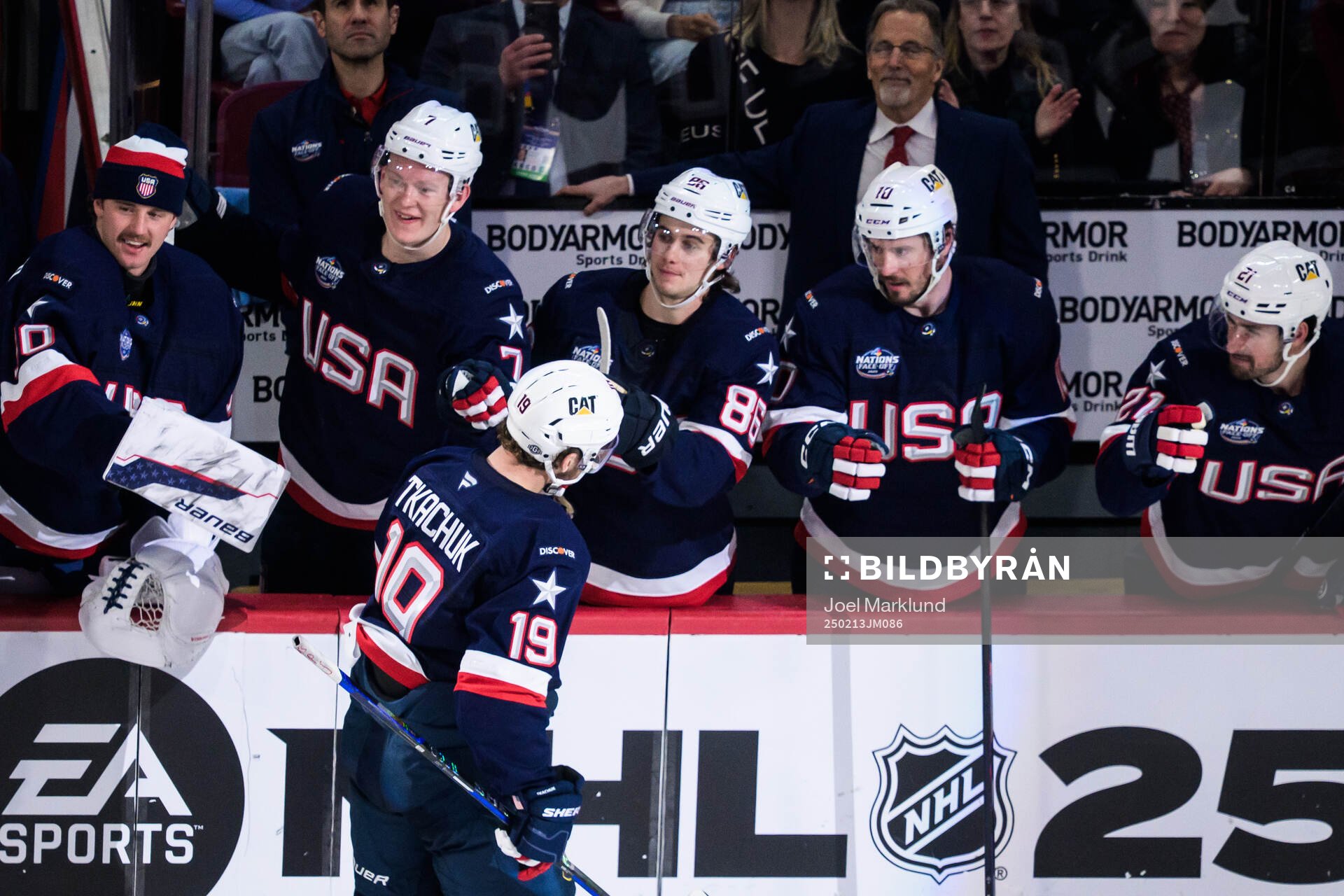 Matthew Tkachuk of USA celebrates with teammates including
