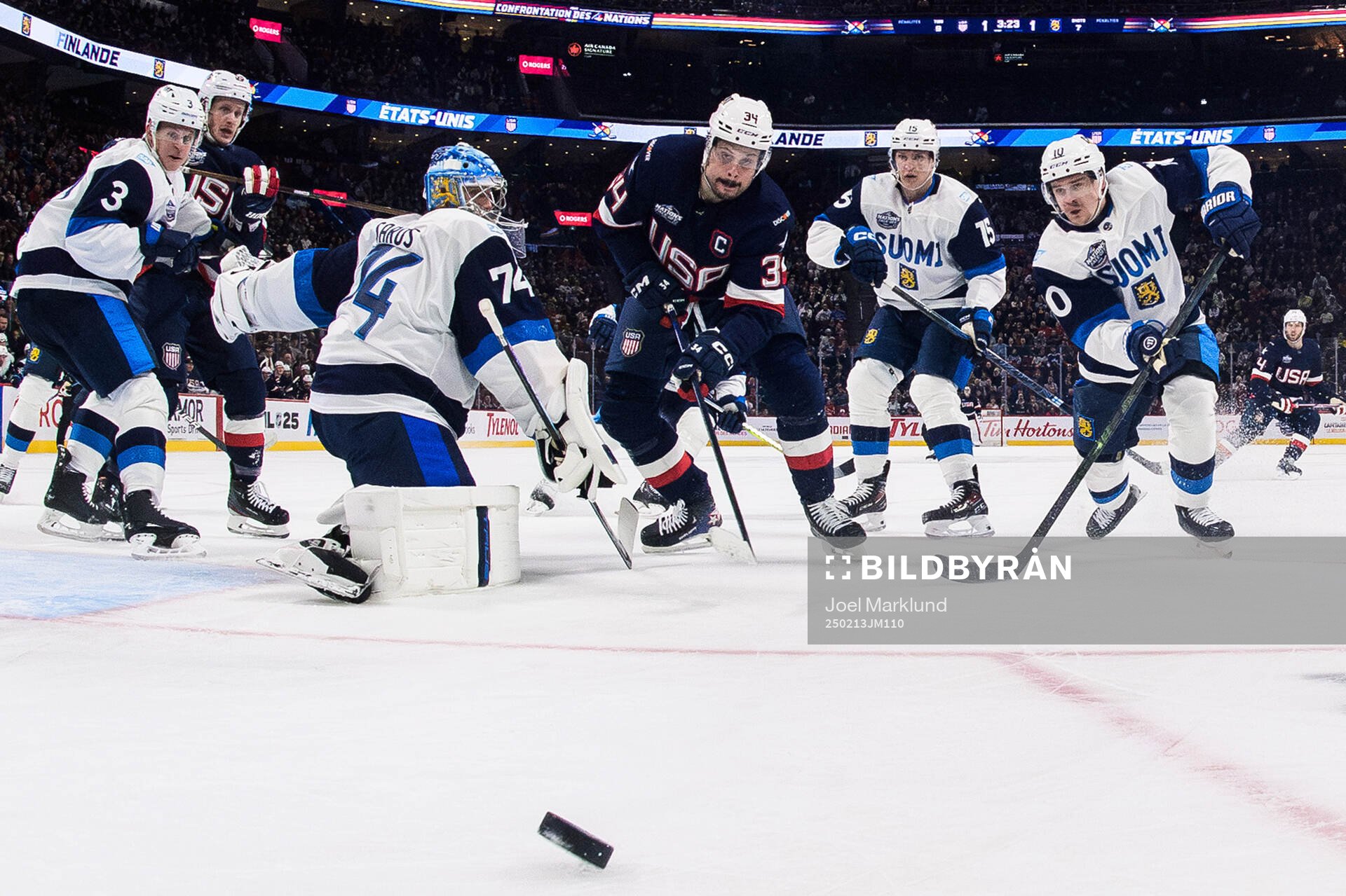 Goaltender Juuse Saros and Henri Jokiharju of Finland are