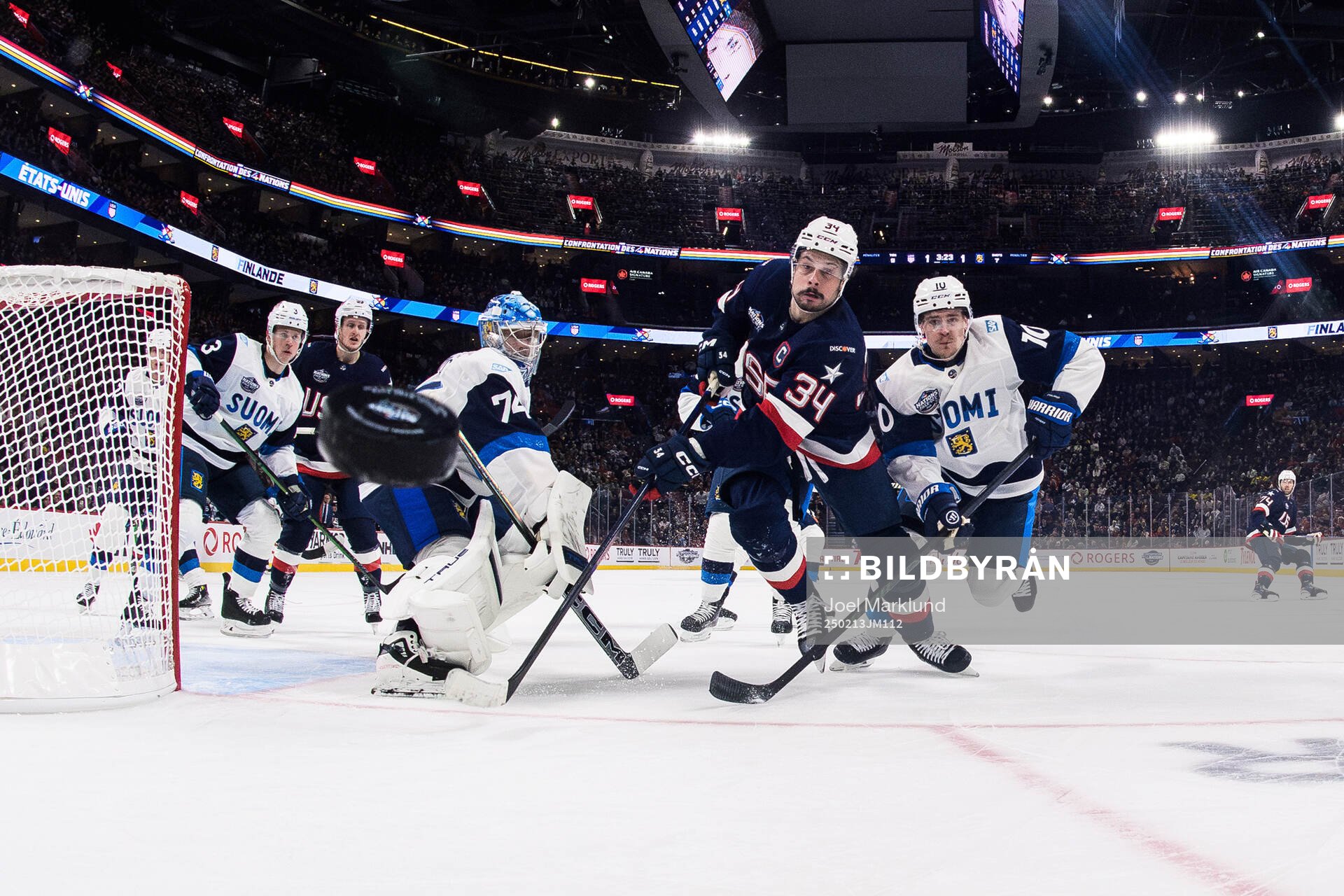 Goaltender Juuse Saros and Henri Jokiharju of Finland are
