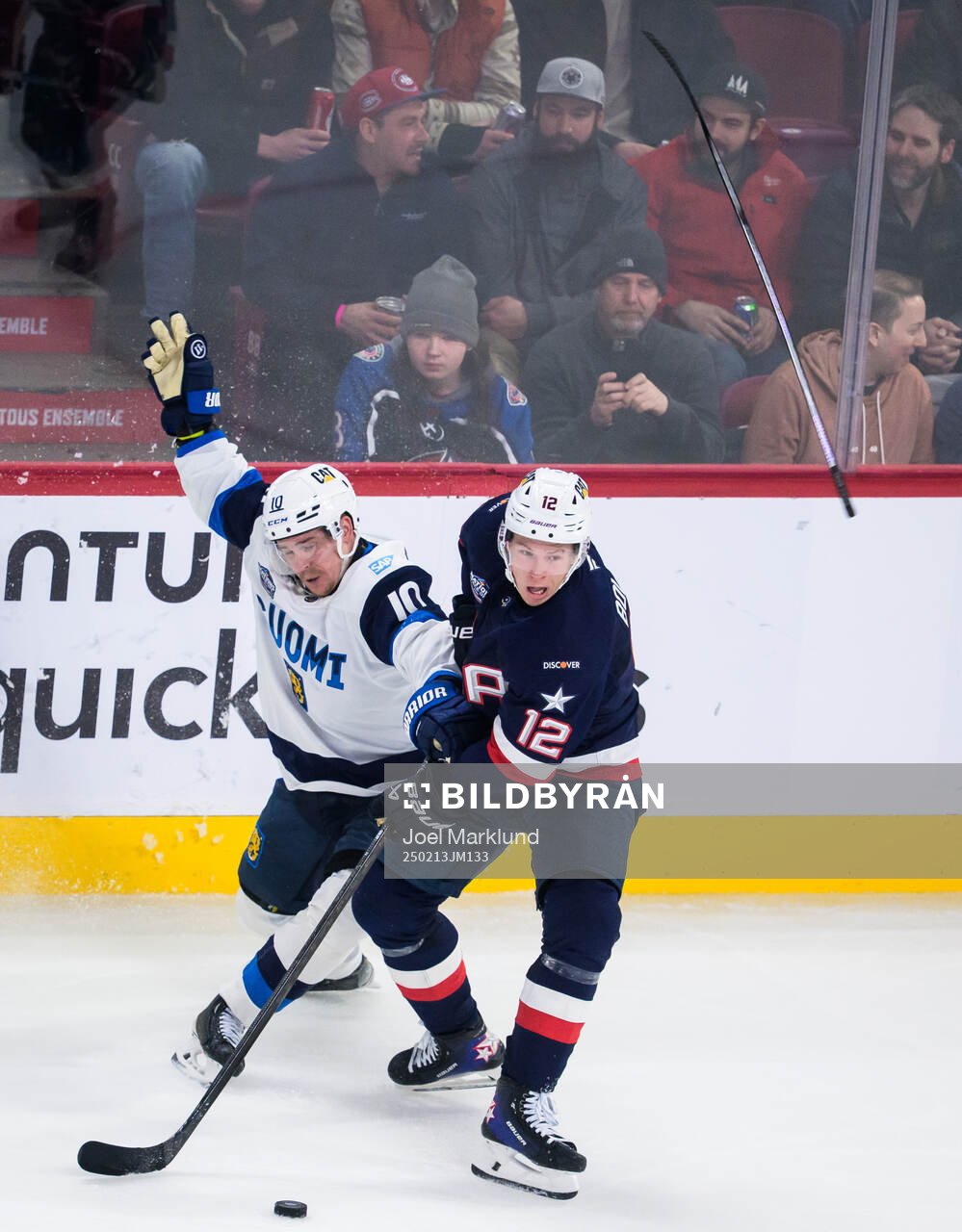 Henri Jokiharju of Finland and Matt Boldy of USA