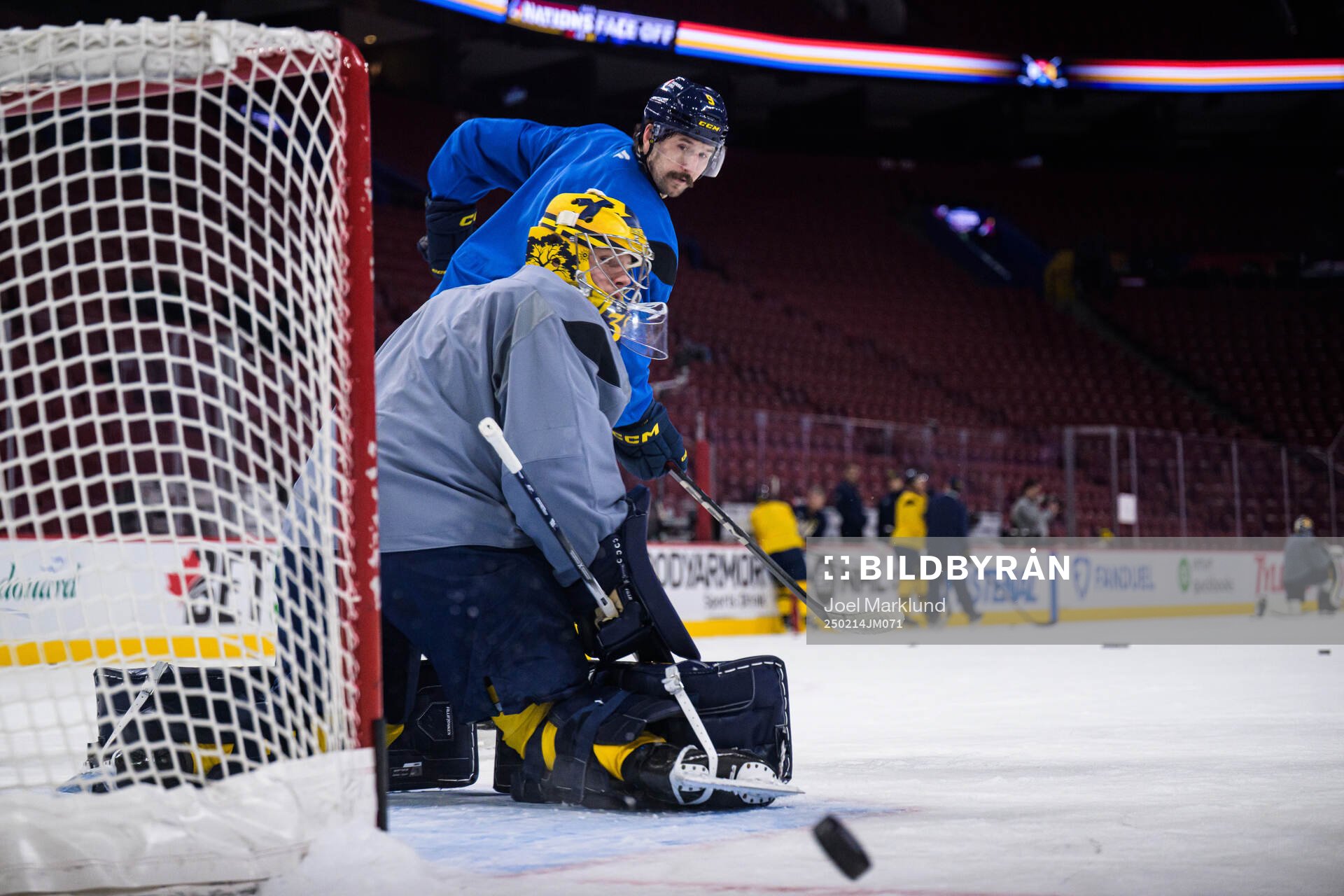 Goaltender Filip Gustavsson and Filip Forsberg of Sweden at