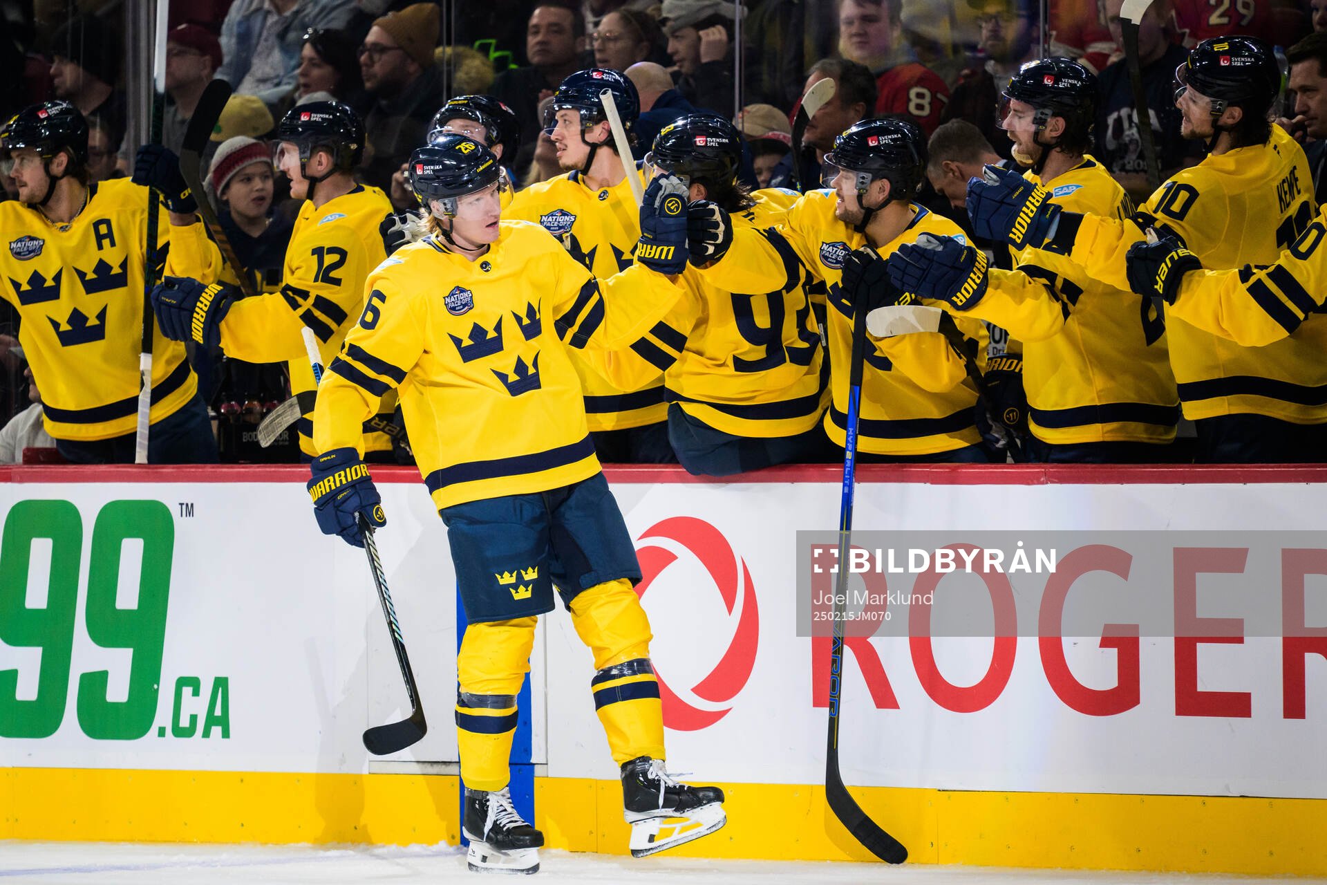 Rasmus Dahlin of Sweden celebrates with teammates