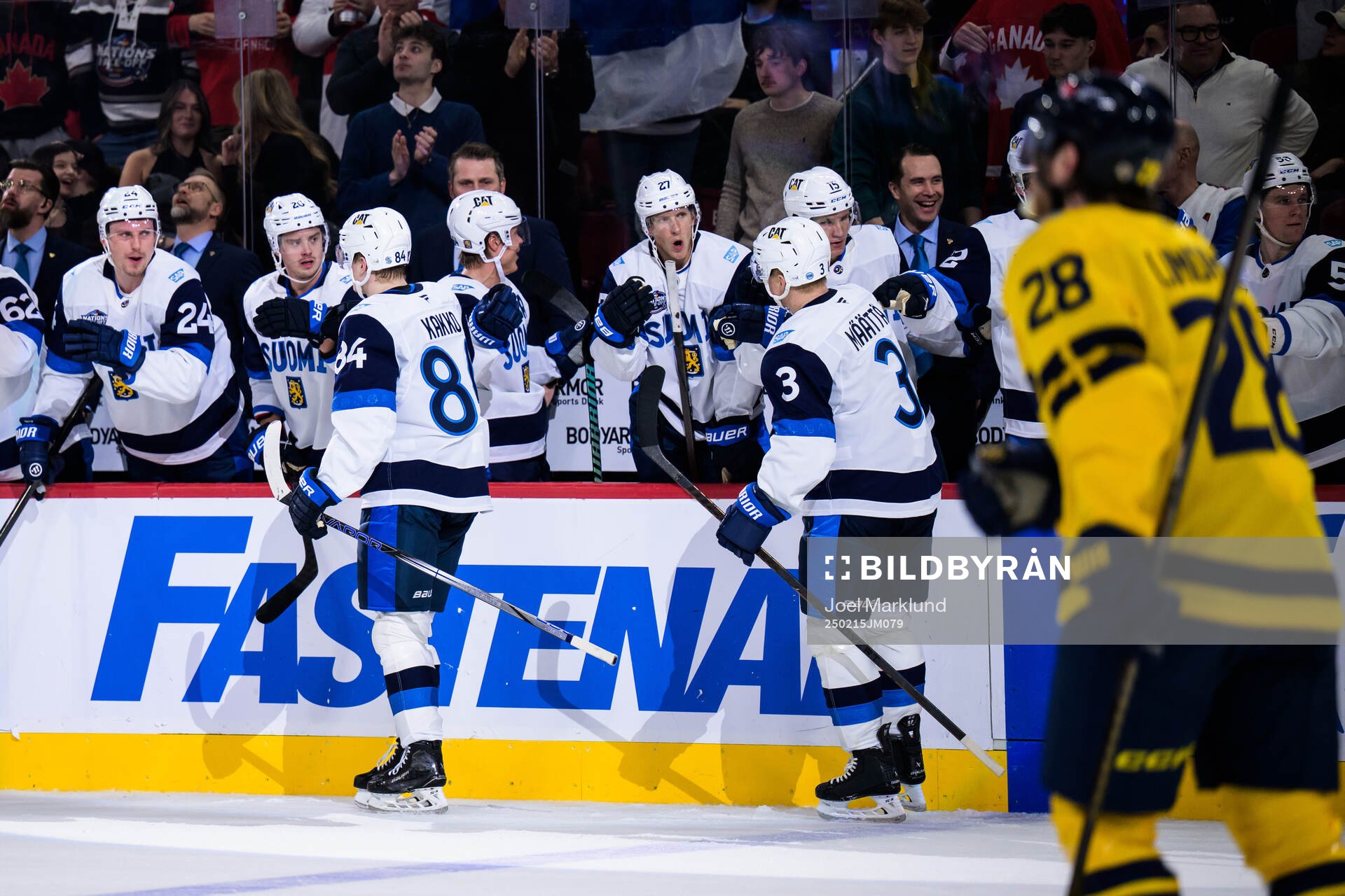 Kaapo Kakko and Olli Määttä of Finland celebrate the 3-3