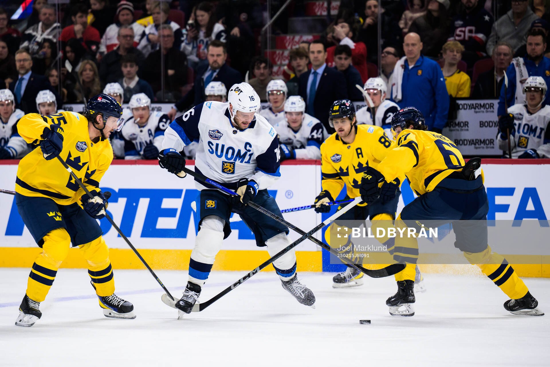 Jonas Brodin and Rickard Rakell of Sweden are being