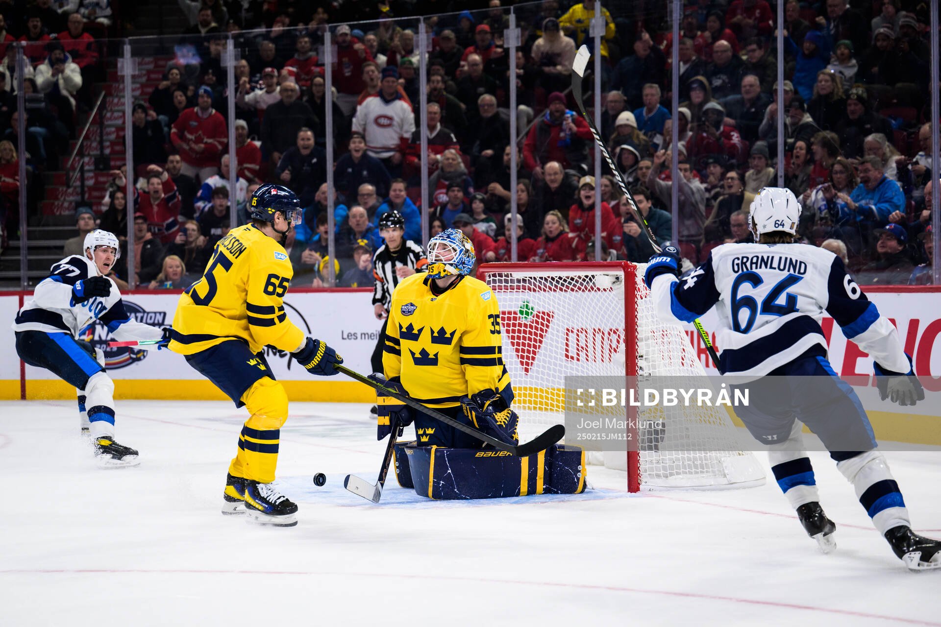 Niko Mikkola and Mikael Granlund of Finland celebrate the