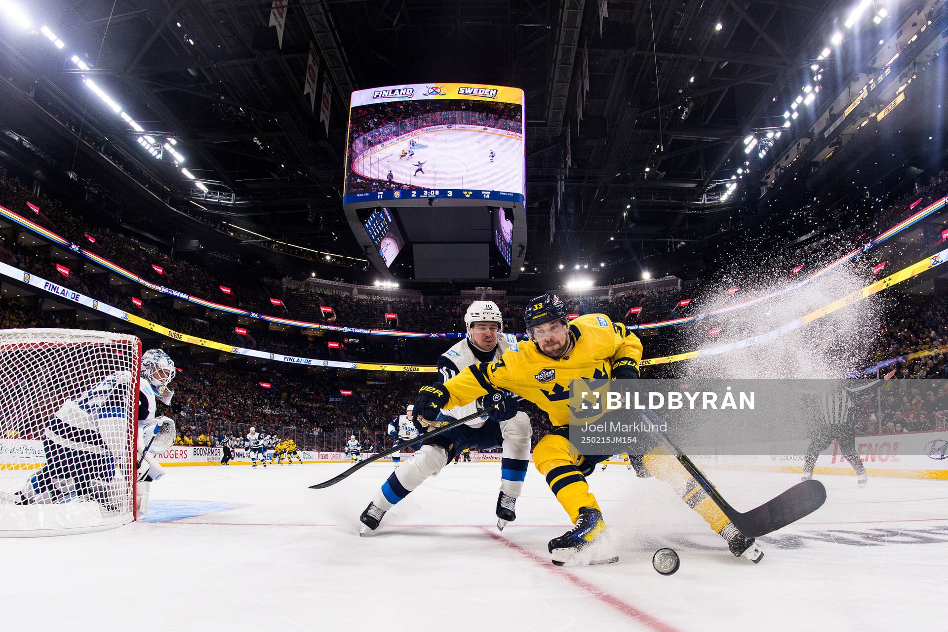 Henri Jokiharju of Finland in action against Viktor