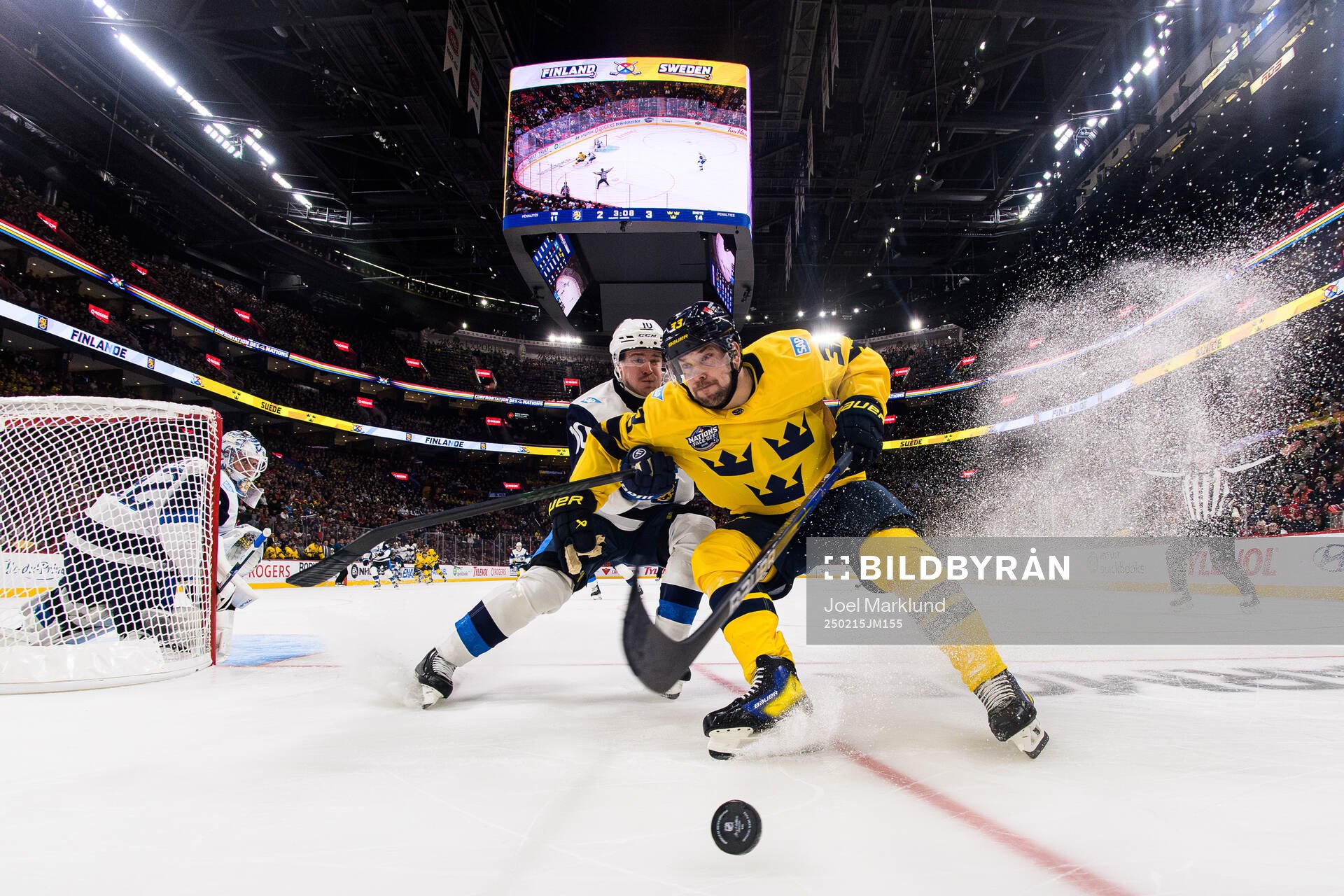 Henri Jokiharju of Finland in action against Viktor