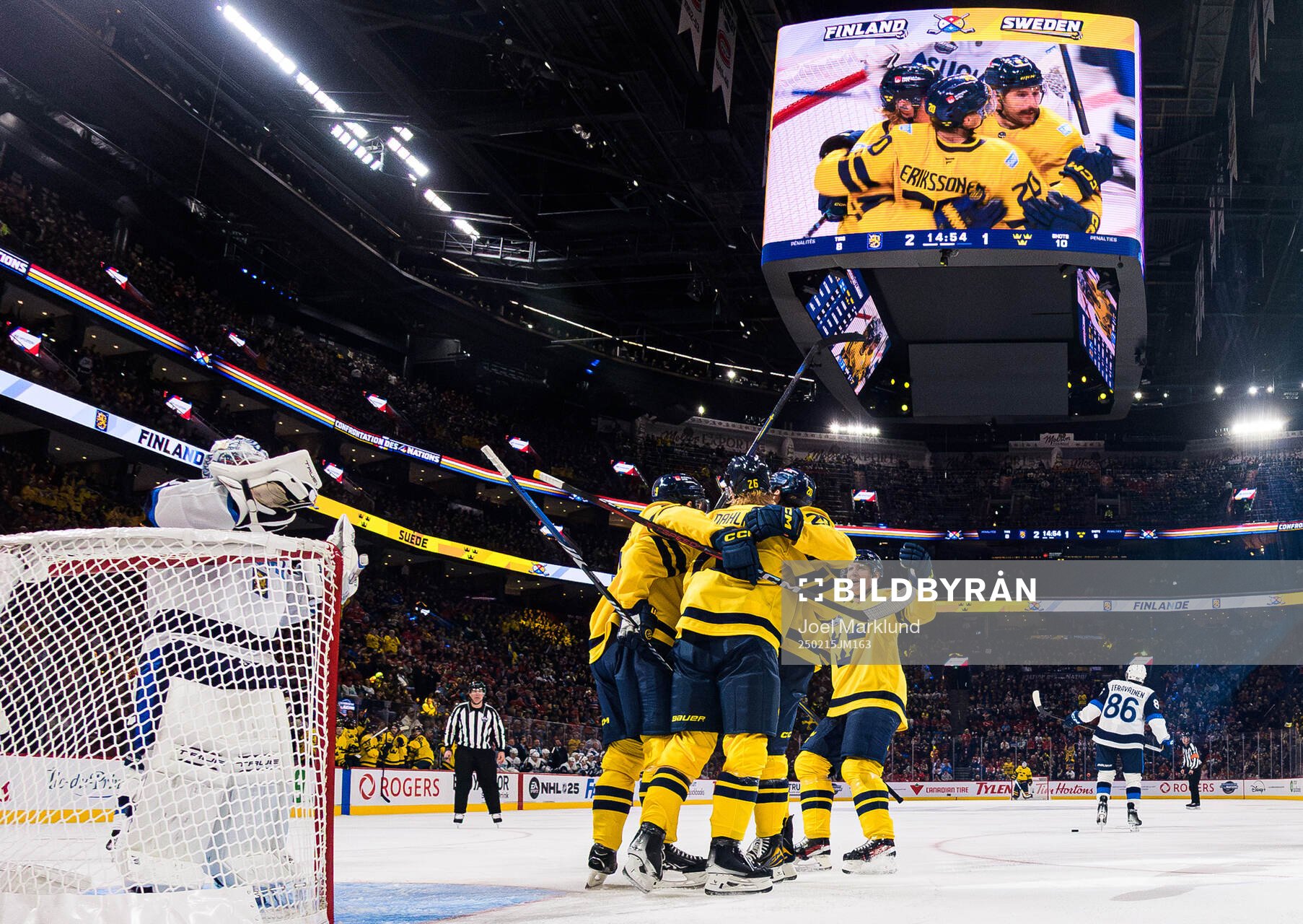 Rasmus Dahlin of Sweden celebrates with teammates