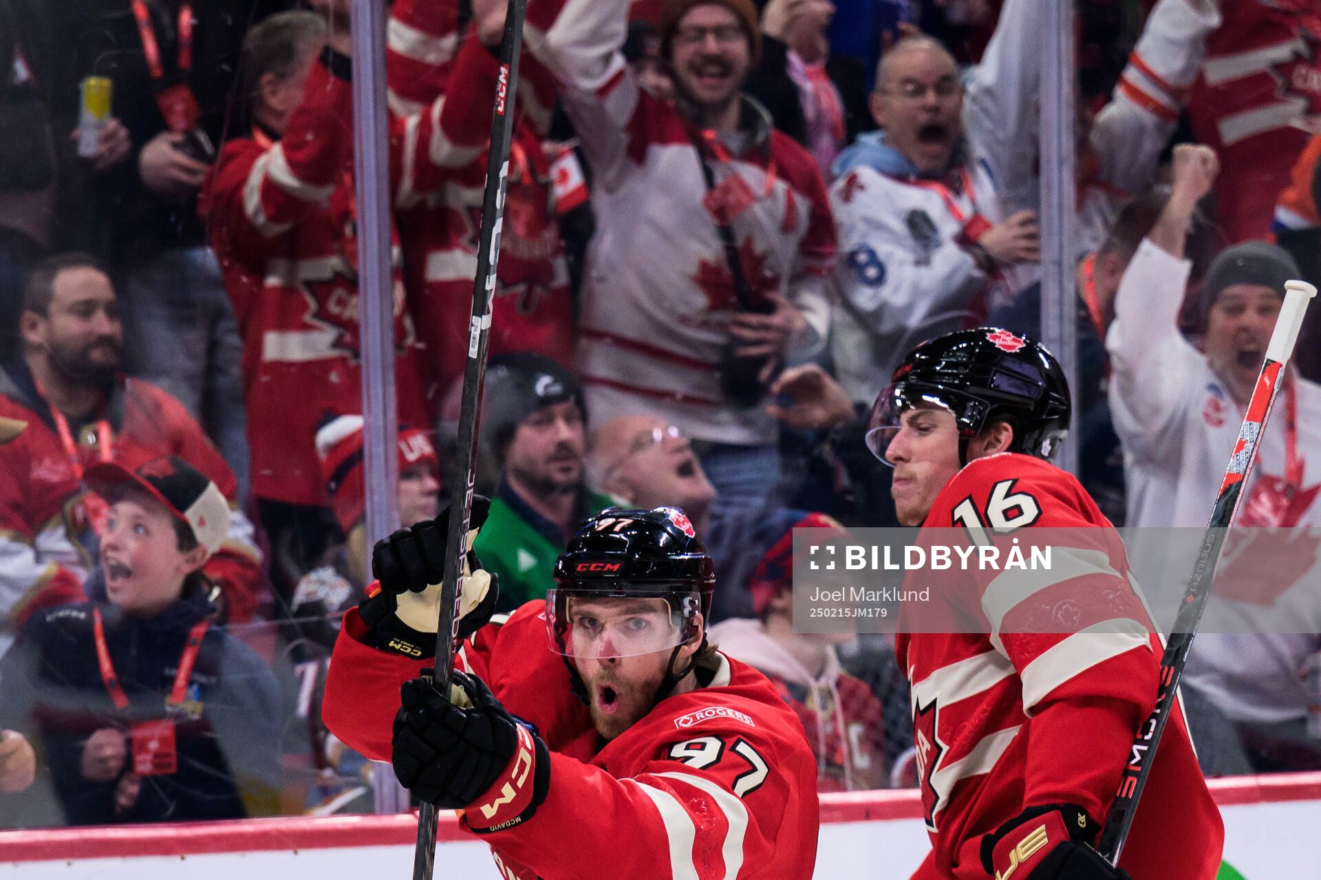 Connor McDavid and Mitch Marner of Canada celebrate the 1-0