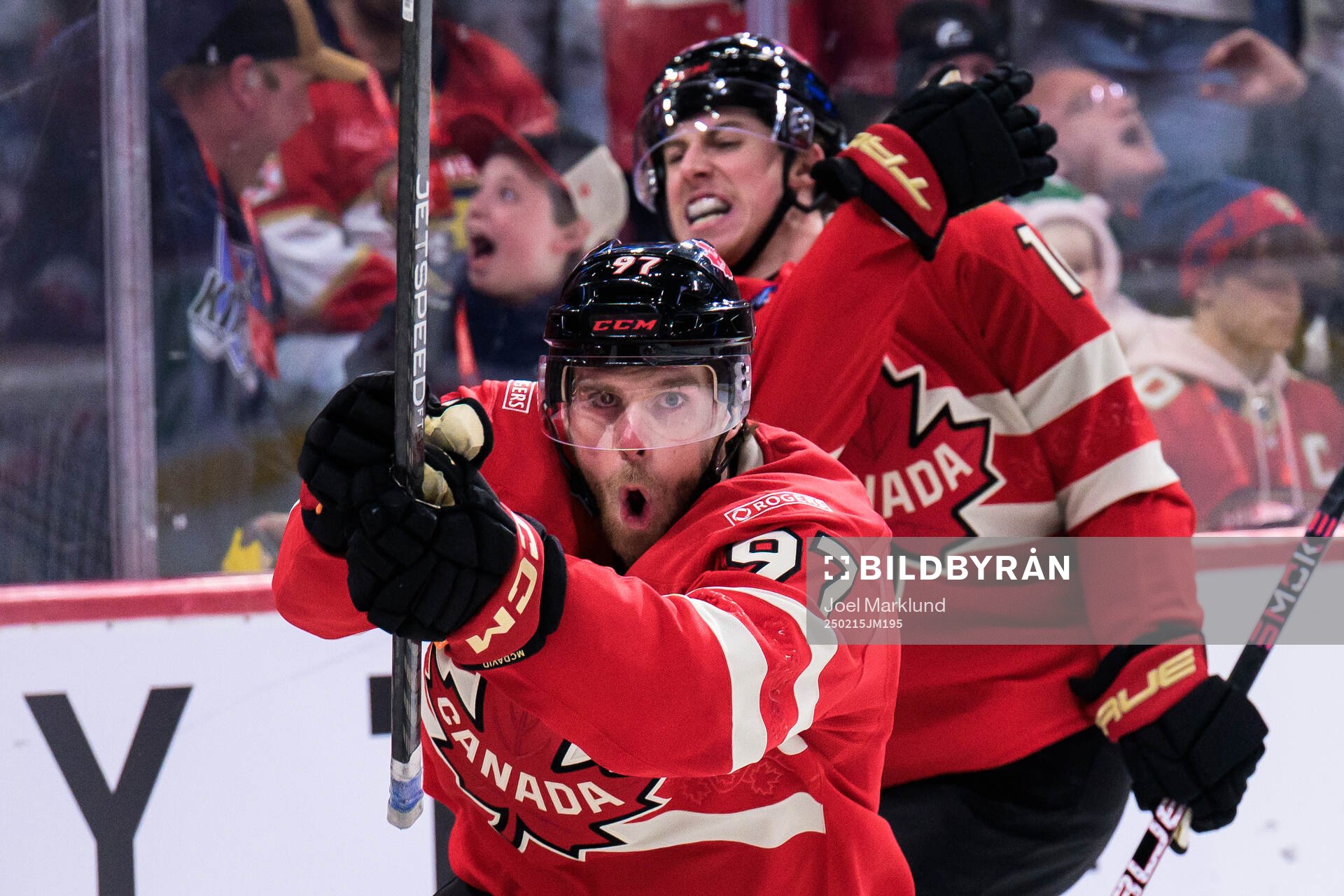 Connor McDavid and Mitch Marner of Canada celebrate the 1-0