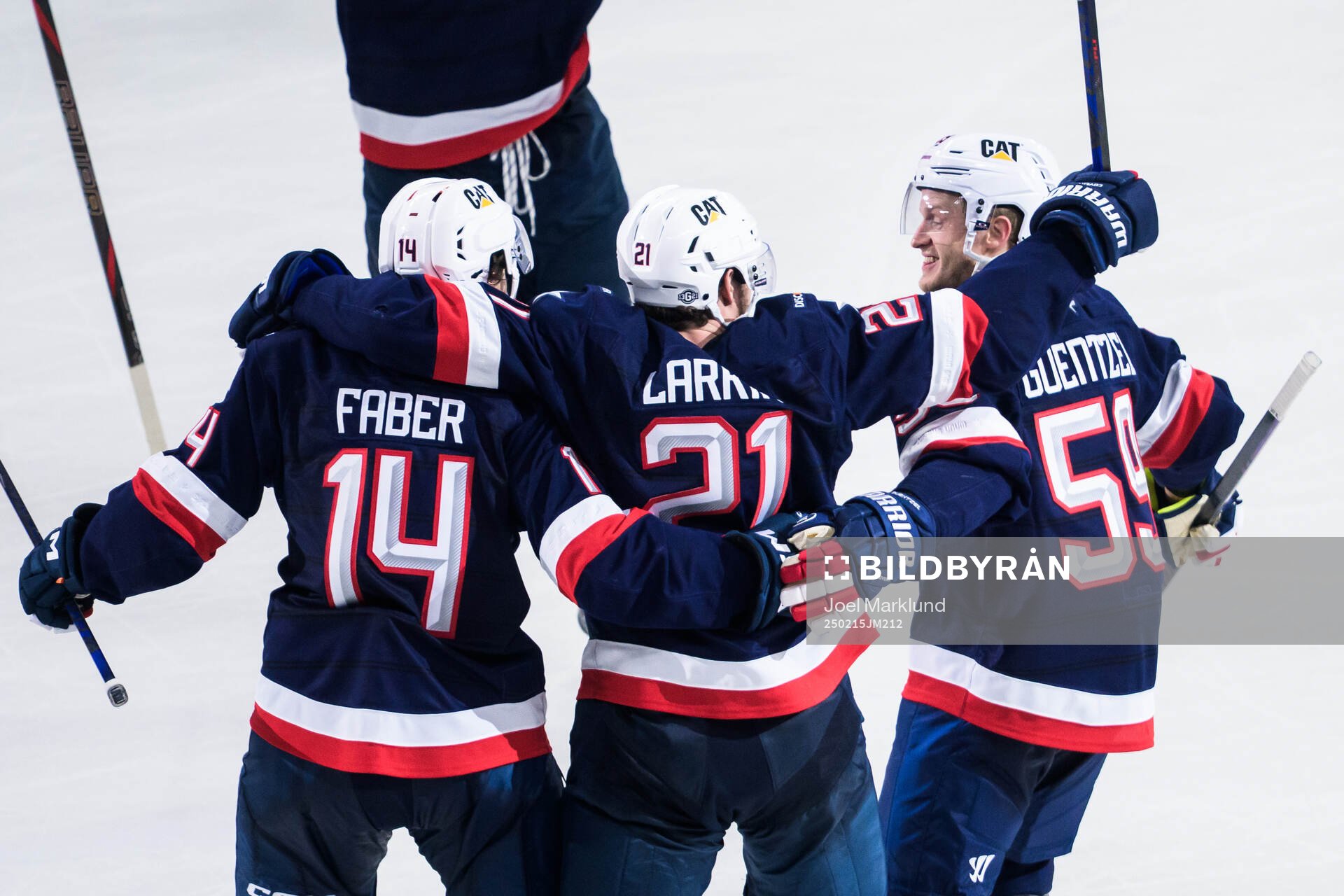 Brock Faber, Dylan Larkin and Jake Guentzel of USA