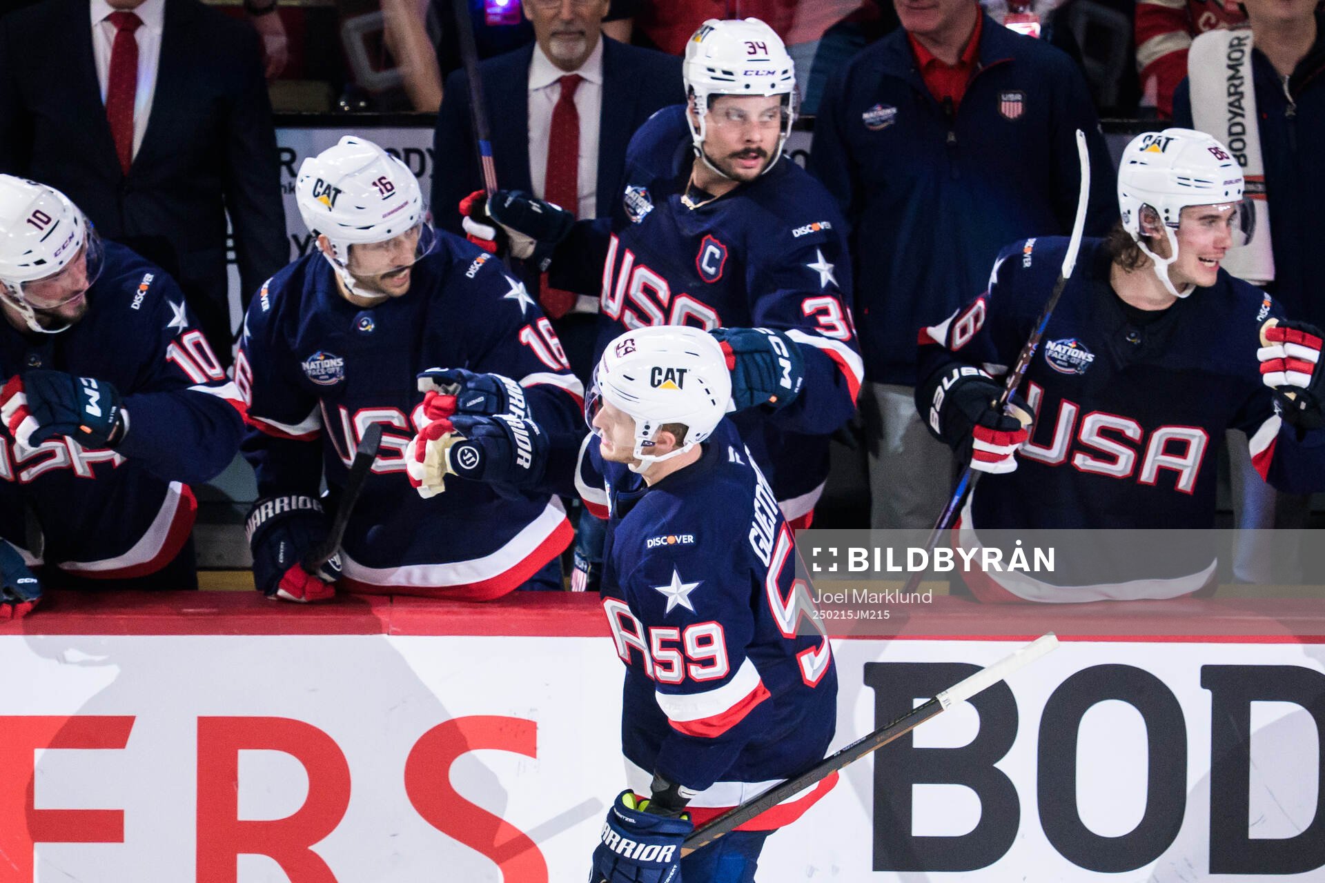 Jake Guentzel of USA celebrates with teammates