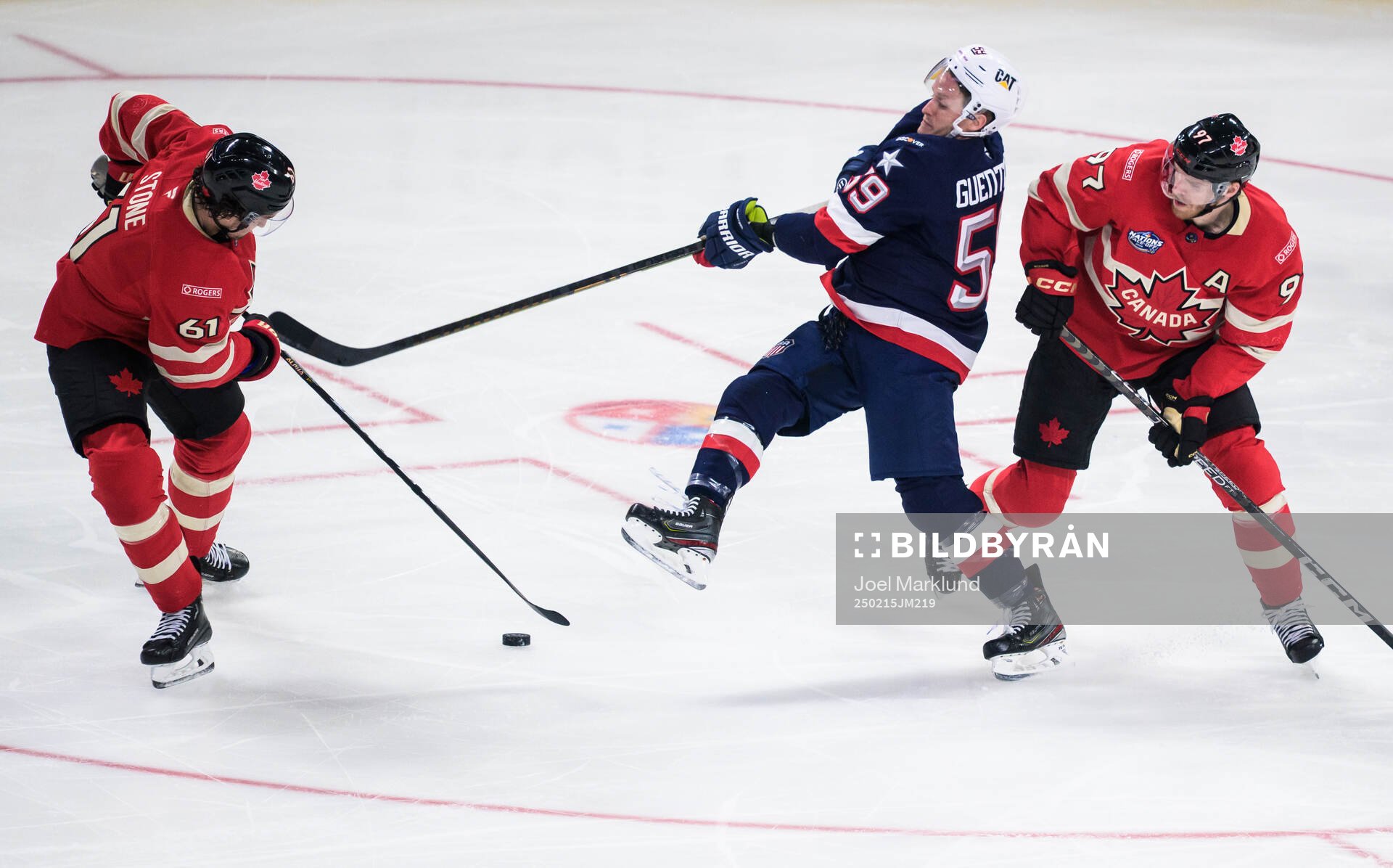 Mark Stone and Connor McDavid of Canada in action against