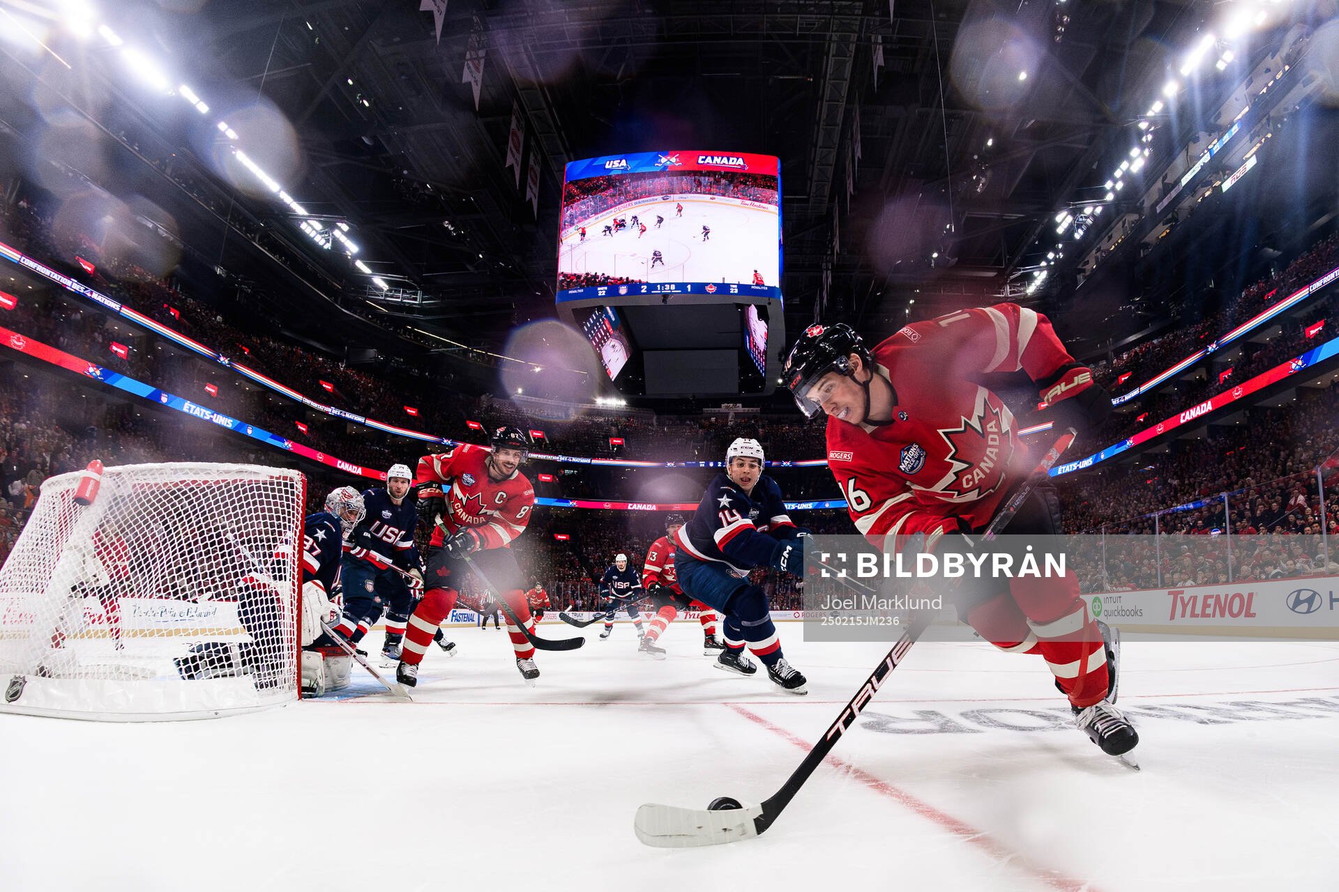 Goaltender Connor Hellebuyck and Brock Faber of USA are