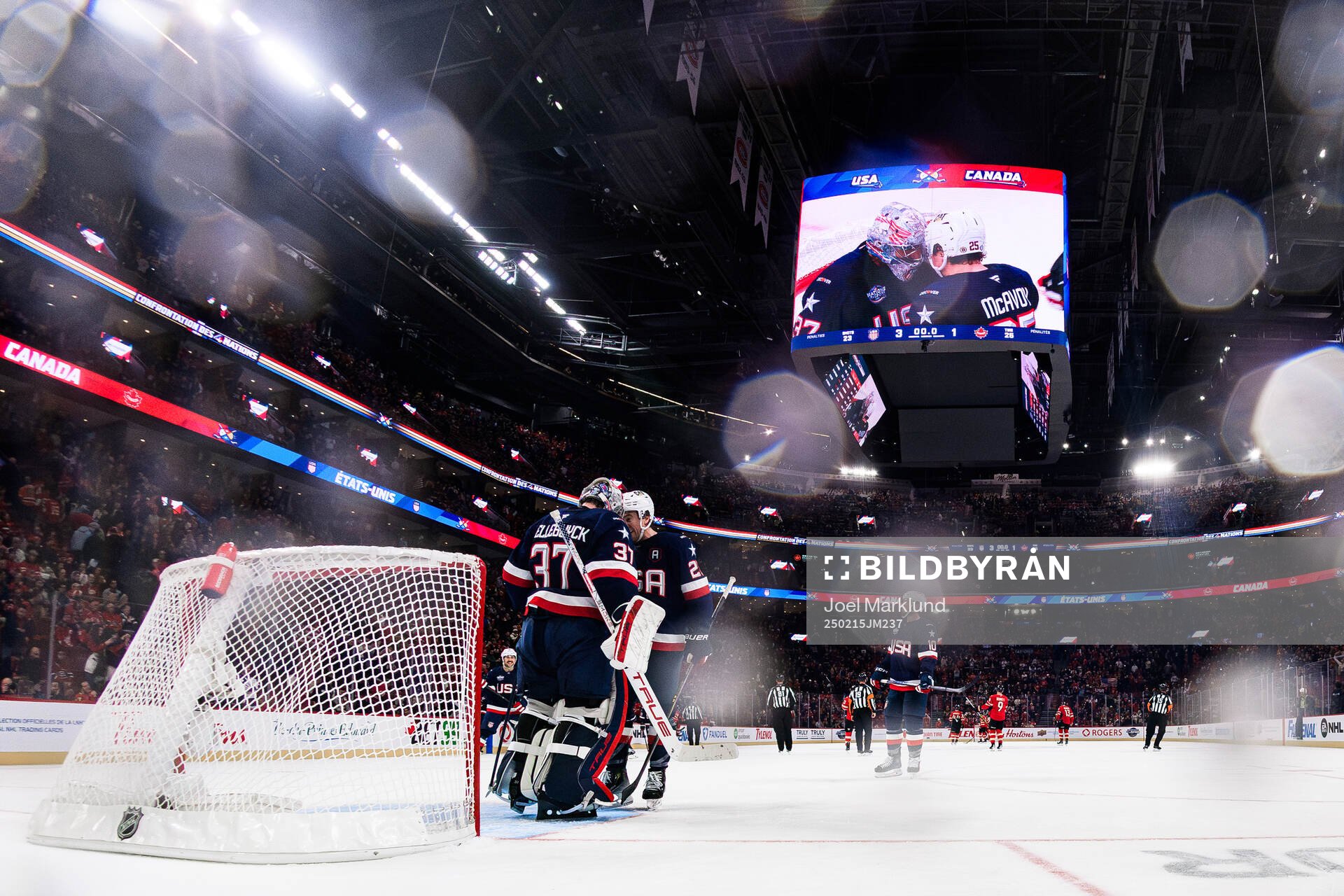 Goaltender Connor Hellebuyck and Charlie McAvoy of USA