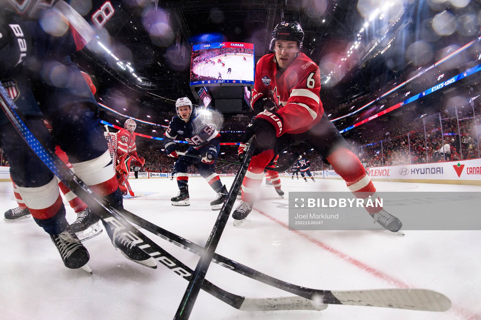 Jake Guentzel of USA and Travis Sanheim of Canada