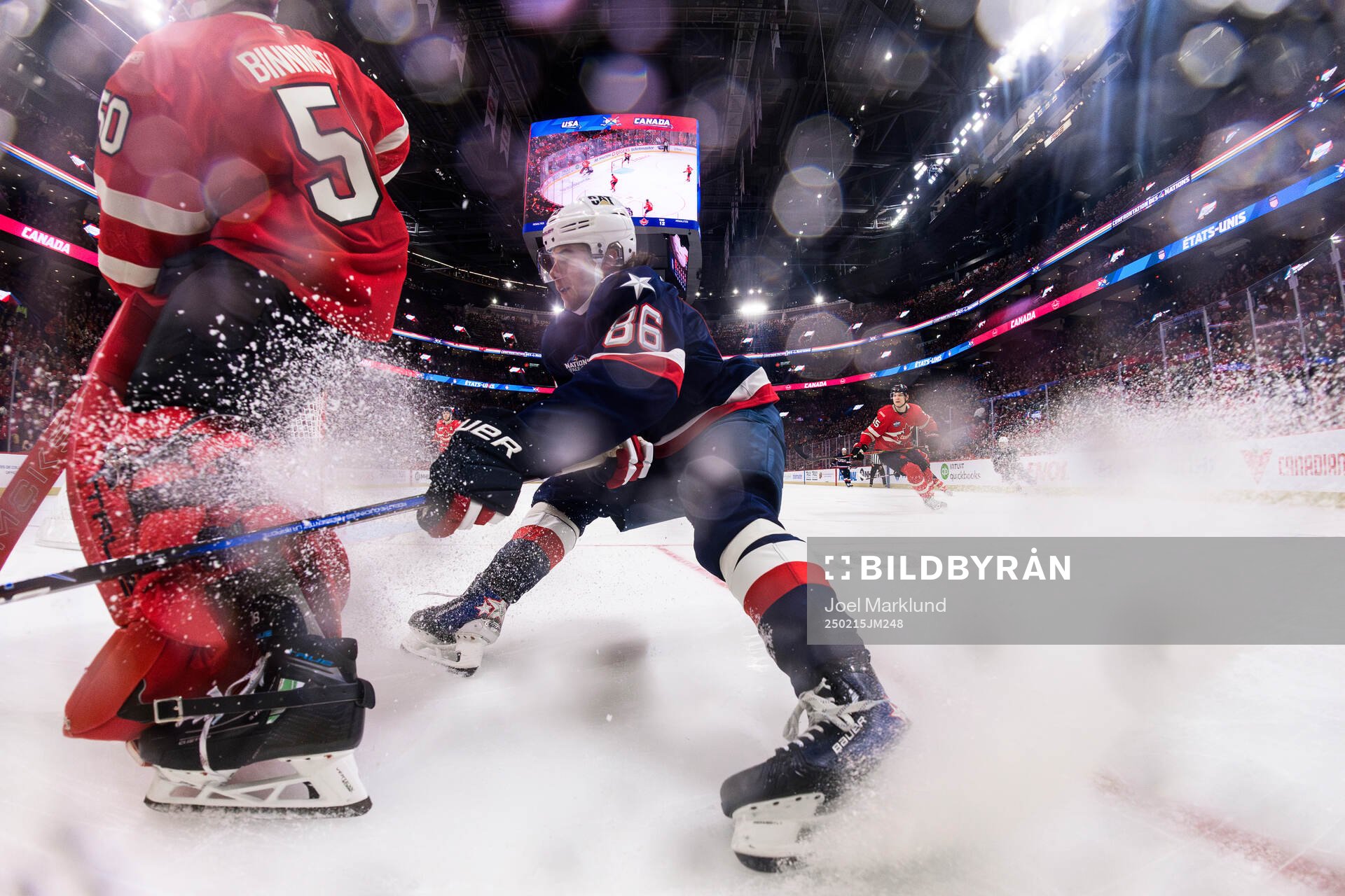 Goaltender Jordan Binnington of Canada and Jack Hughes of
