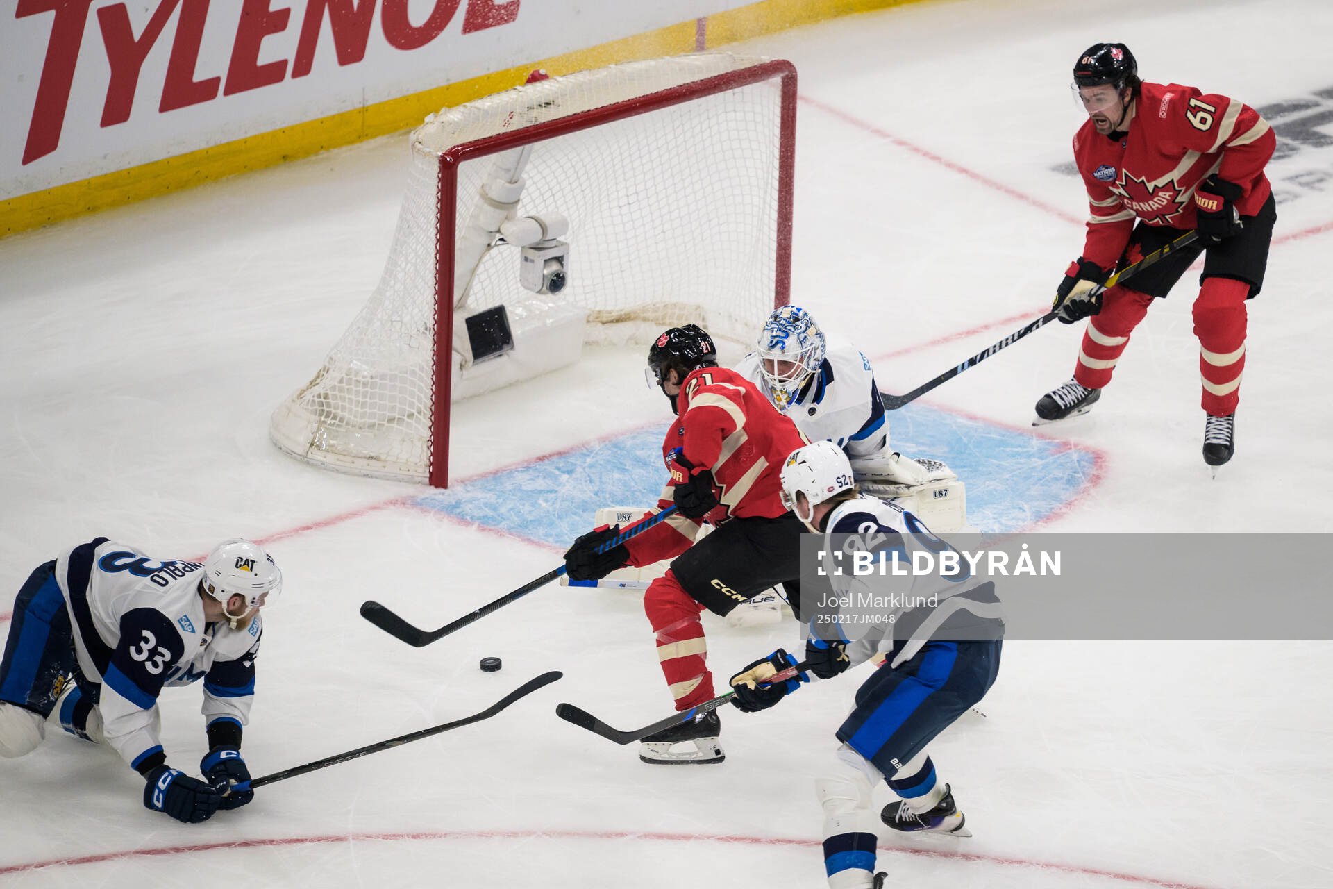 Brayden Point and Mark Stone of Canada challenge Nikolas
