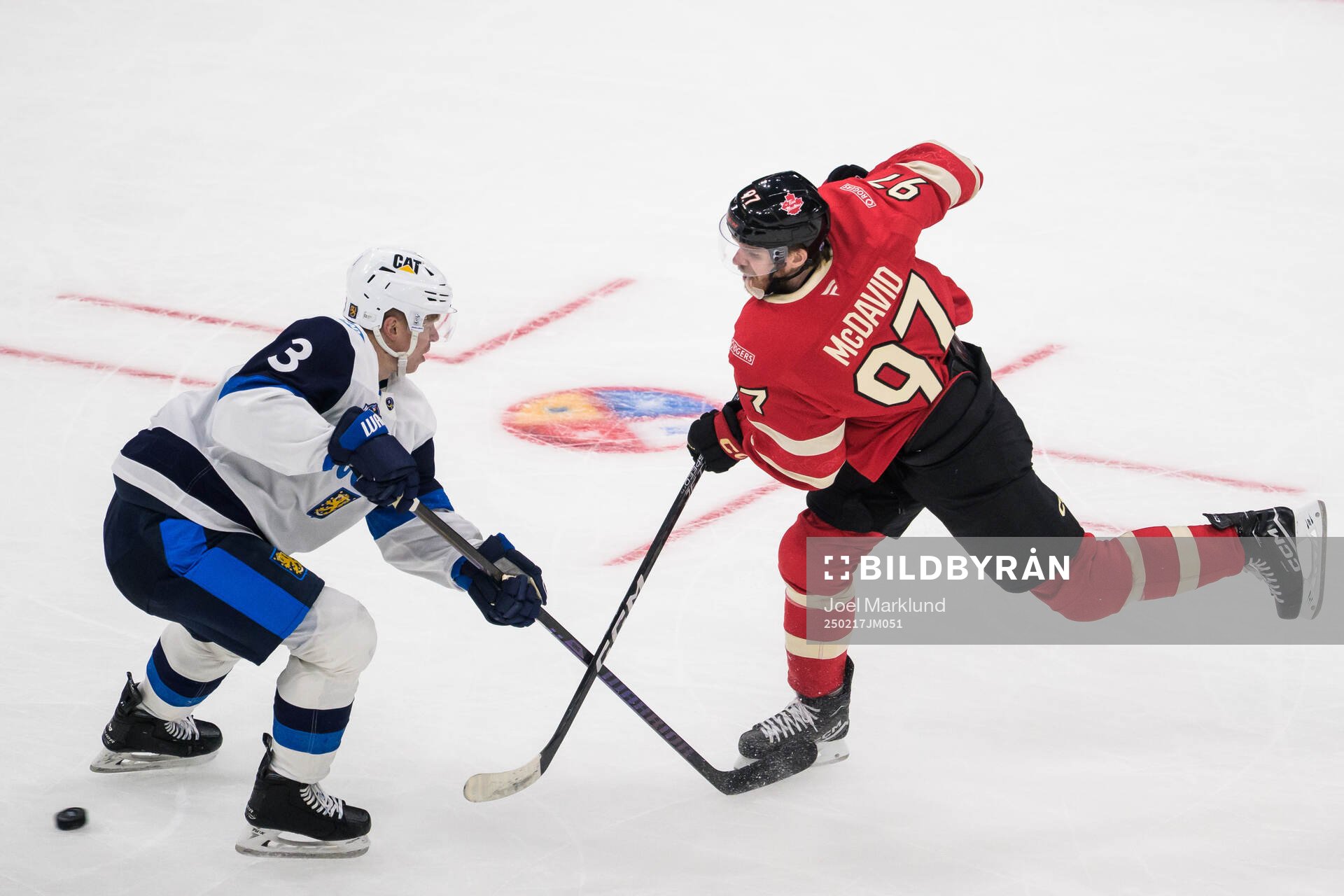 Olli Määttä of Finland and Connor McDavid of Canada