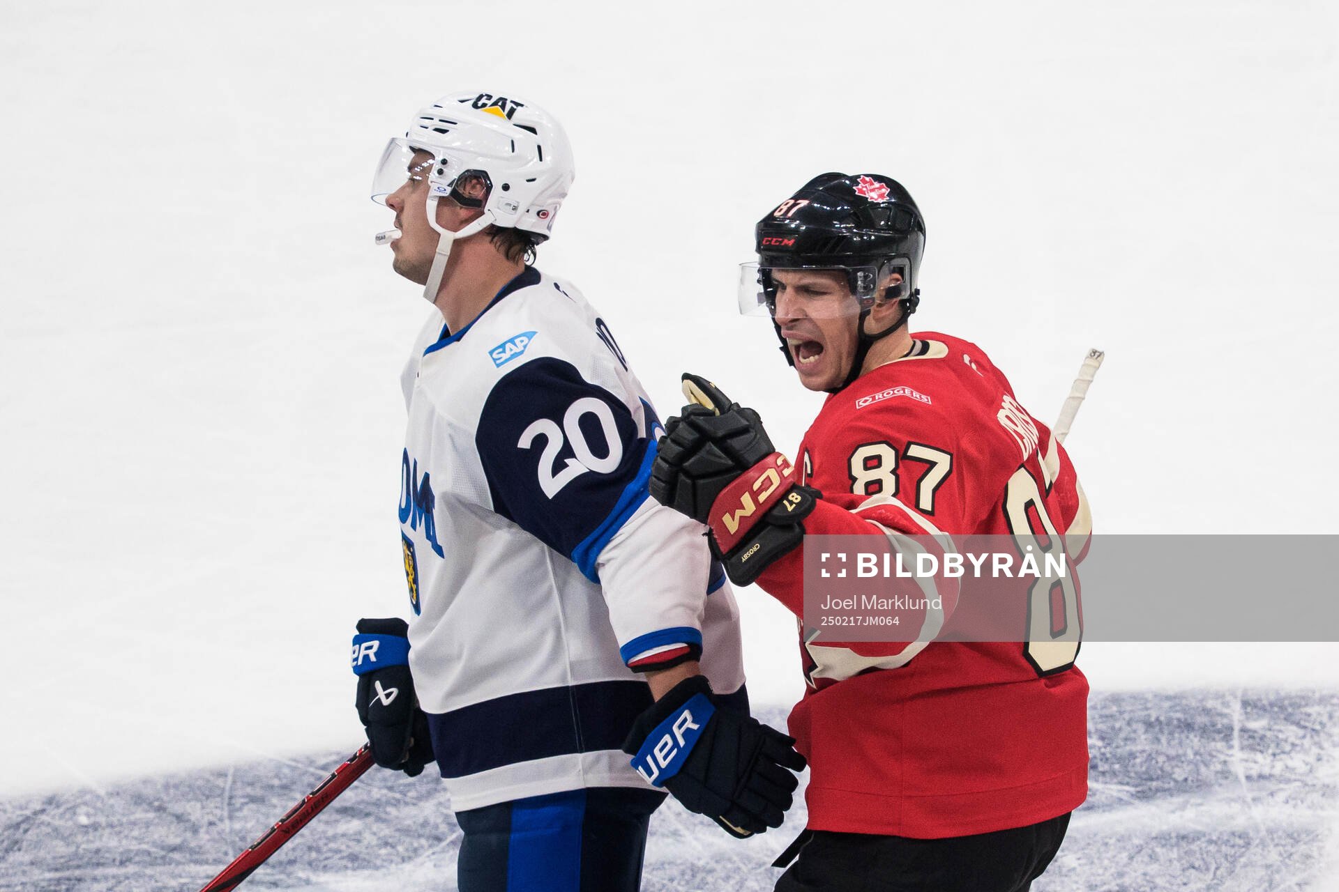 Sebastian Aho of Finland looks dejected when Sidney Crosby