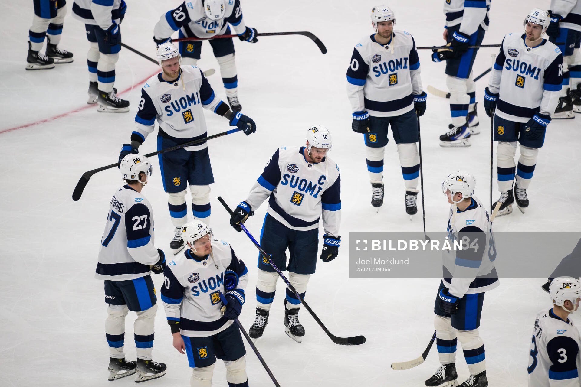 Aleksander Barkov and his teammates of Finland look dejected