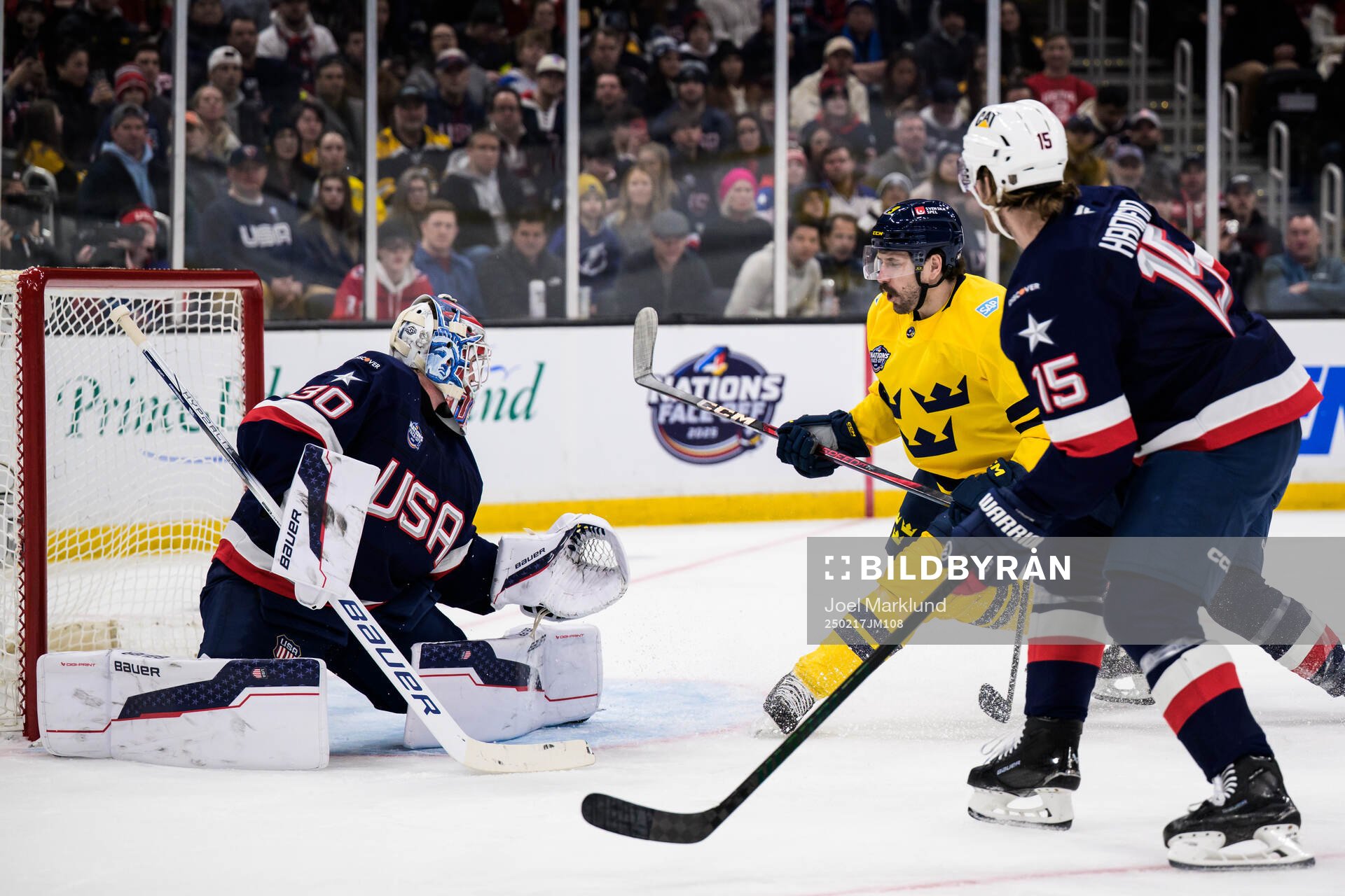 Goaltender Jake Oettinger of USA and Filip Forsberg of