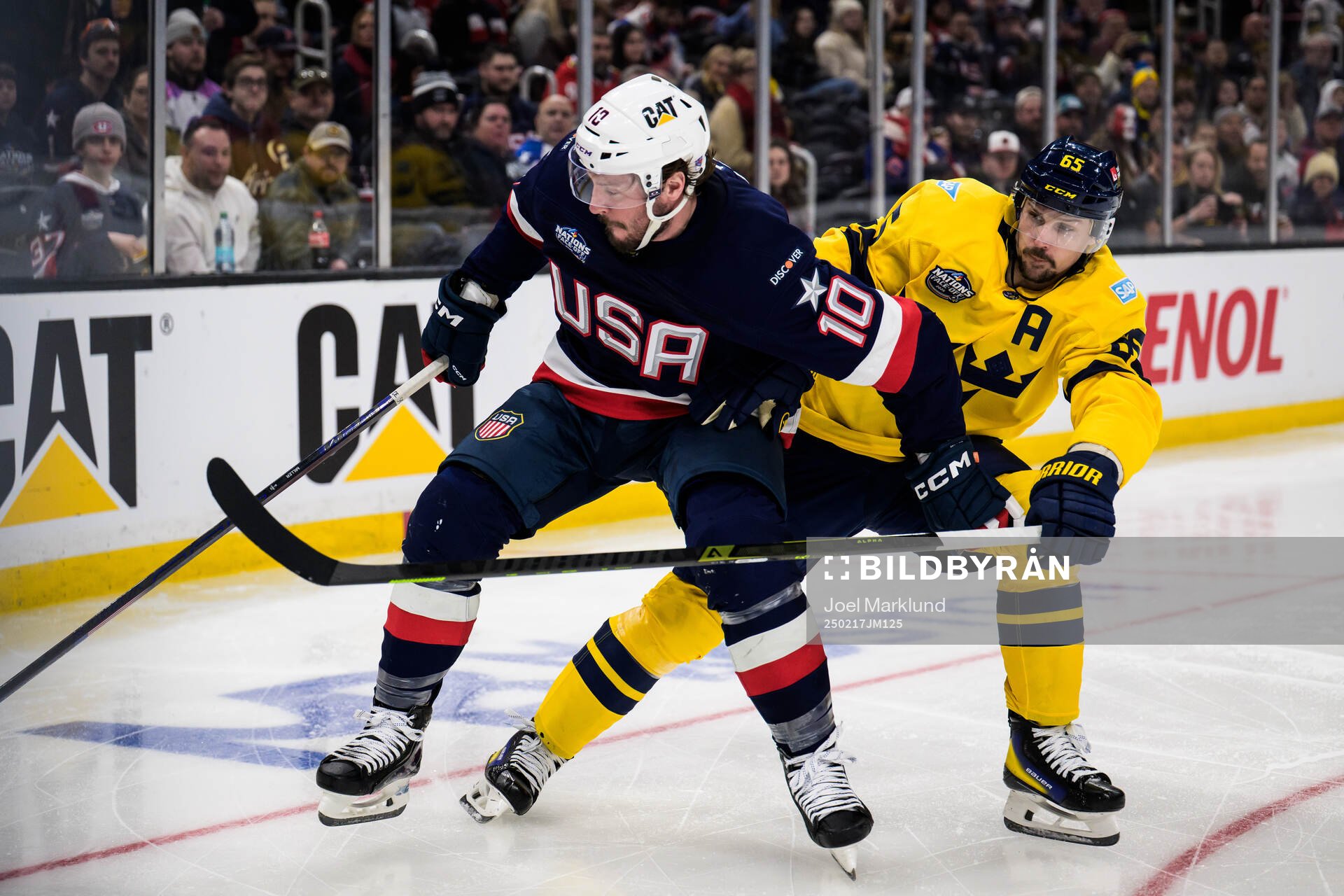 J.T. Miller of USA and Erik Karlsson of Sweden