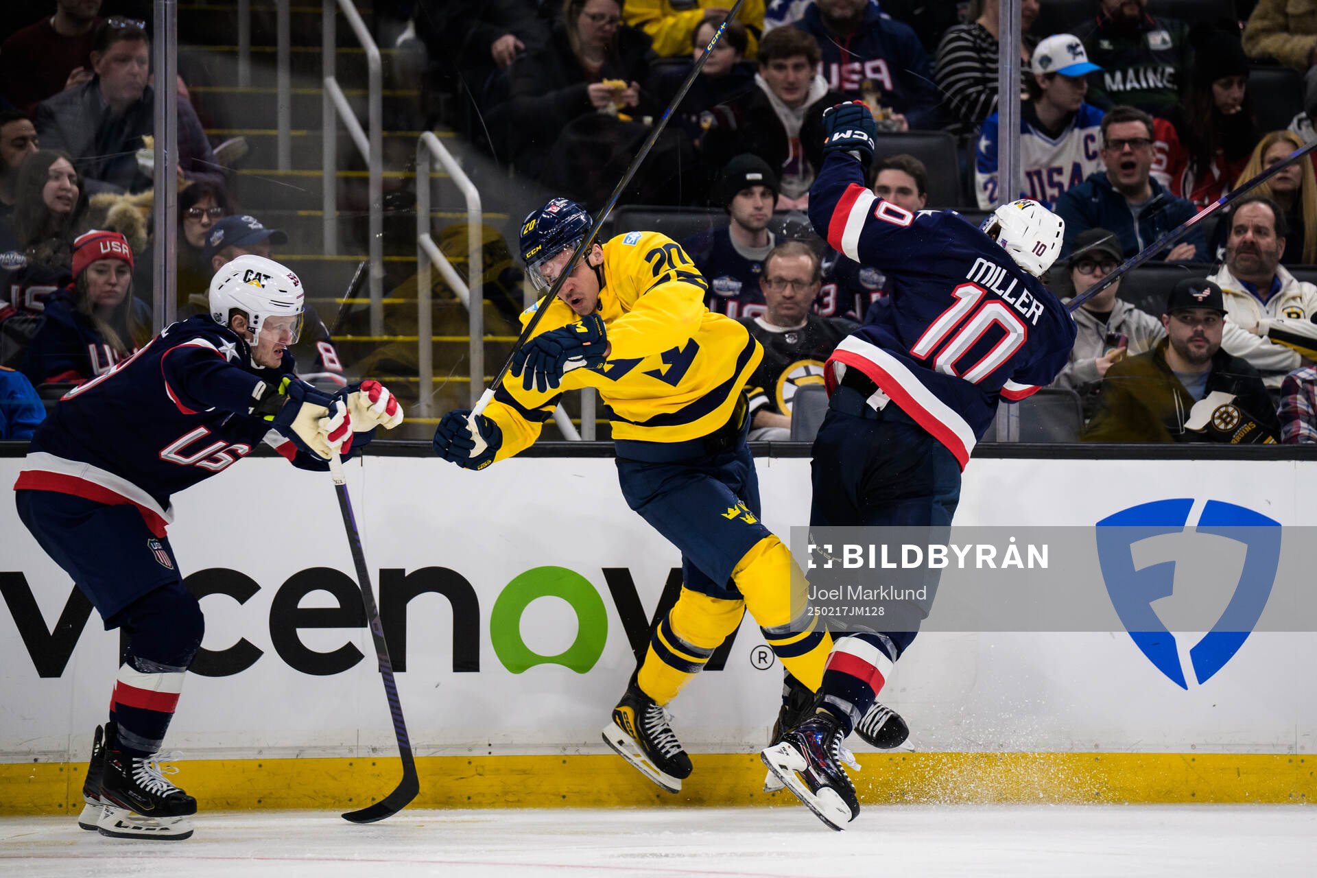 Joel Eriksson Ek of Sweden is tackled by J.T. Miller of USA
