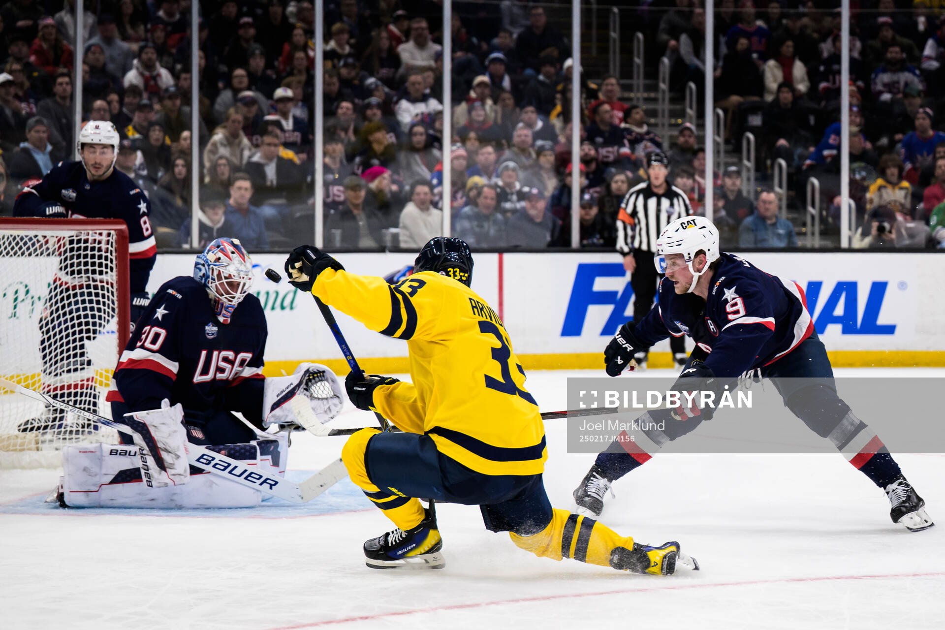 Goaltender Jake Oettinger and Jack Eichel of USA are being