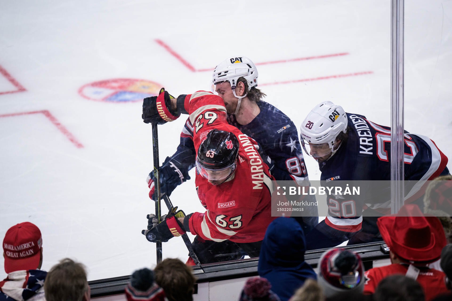 Brad Marchand of Canada in action against Jake Sanderson