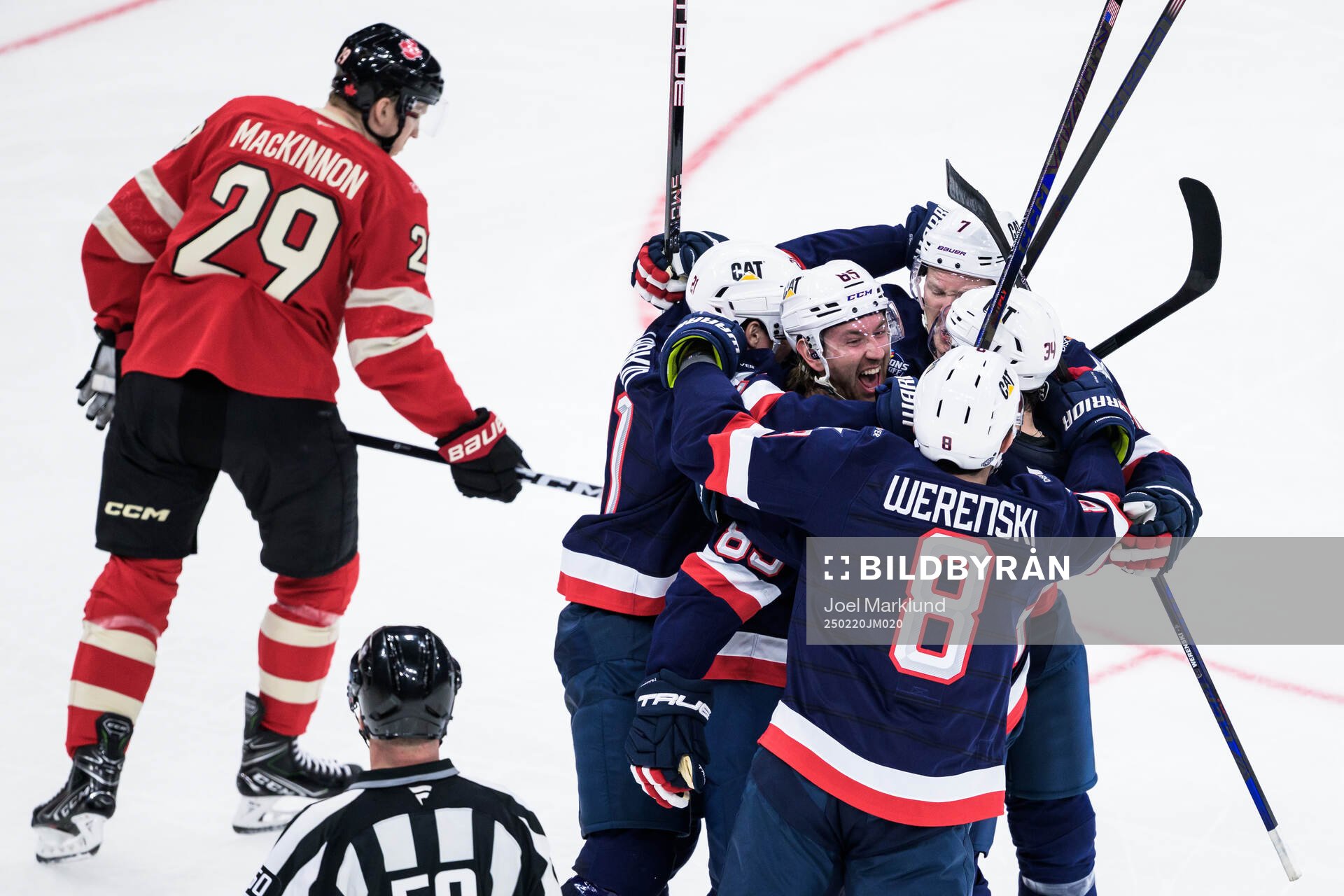 Jake Sanderson of USA celebrates with teammates
