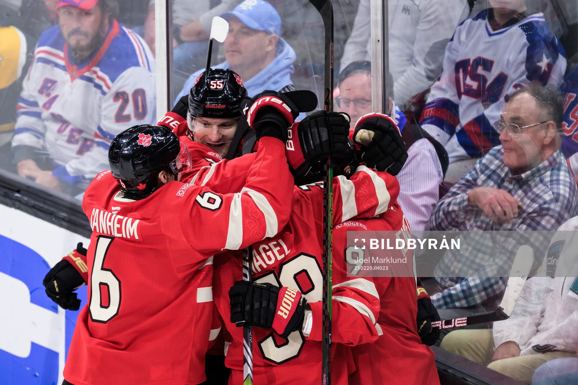 Sam Bennett of Canada celebrates with teammates