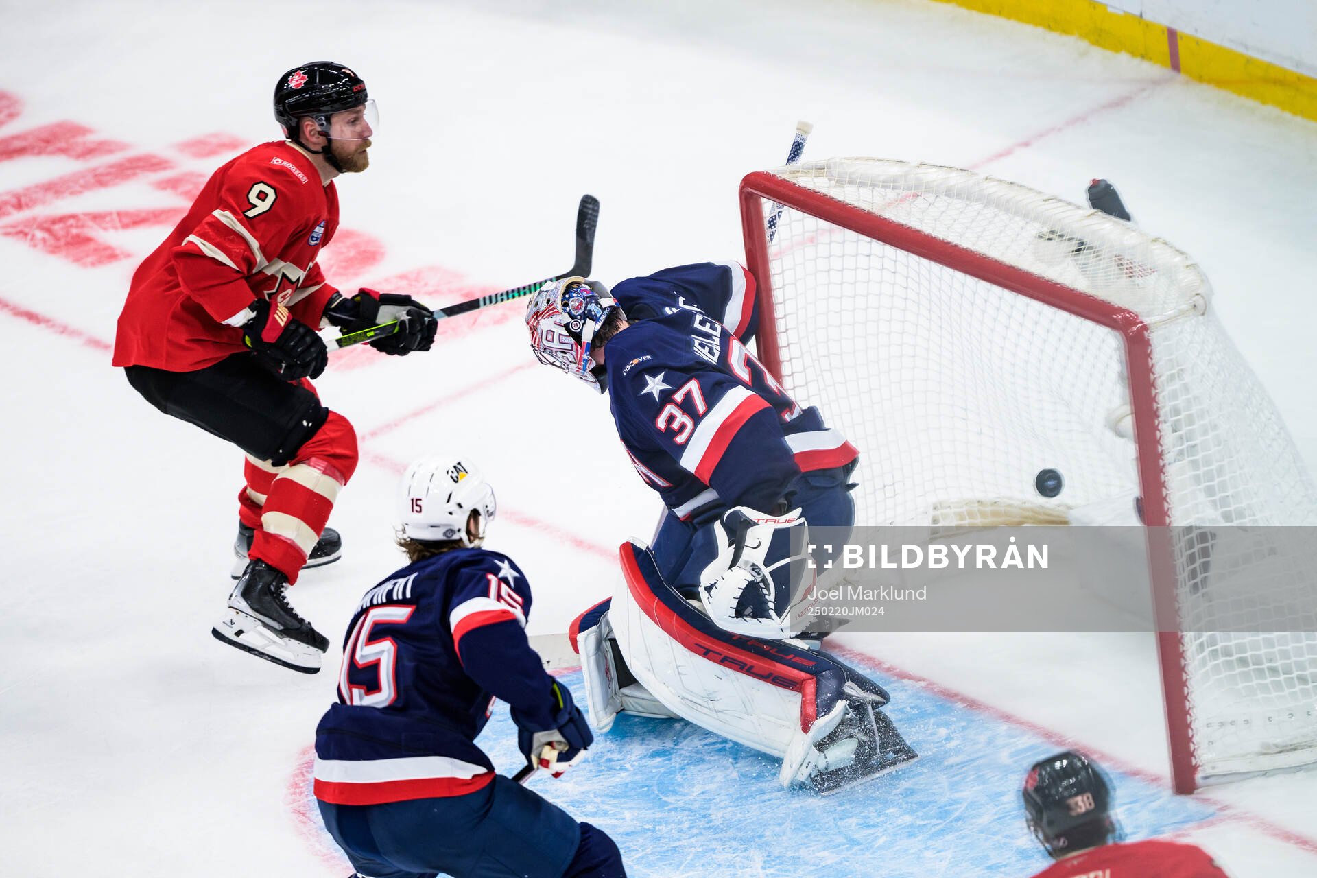 Sam Bennett of Canada scores the 2-2 goal behind goaltender
