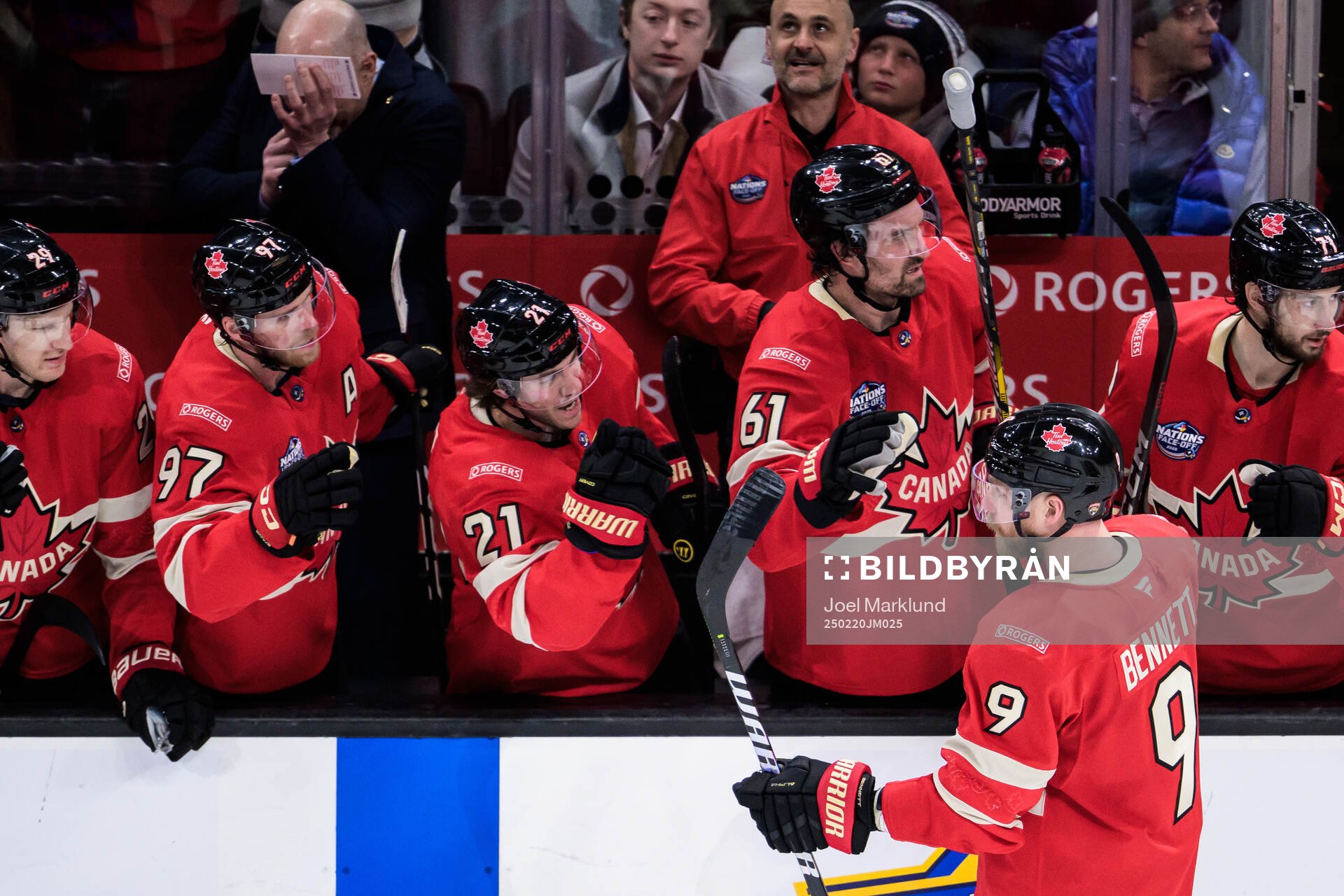 Sam Bennett of Canada celebrates with teammates