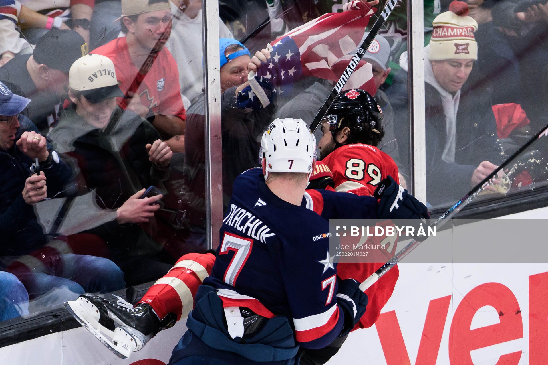 Brady Tkachuk of USA tackles Drew Doughty of Canada