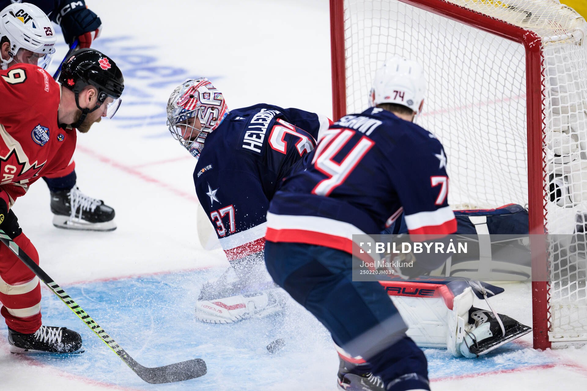 Sam Bennett of Canada challenges goaltender Connor