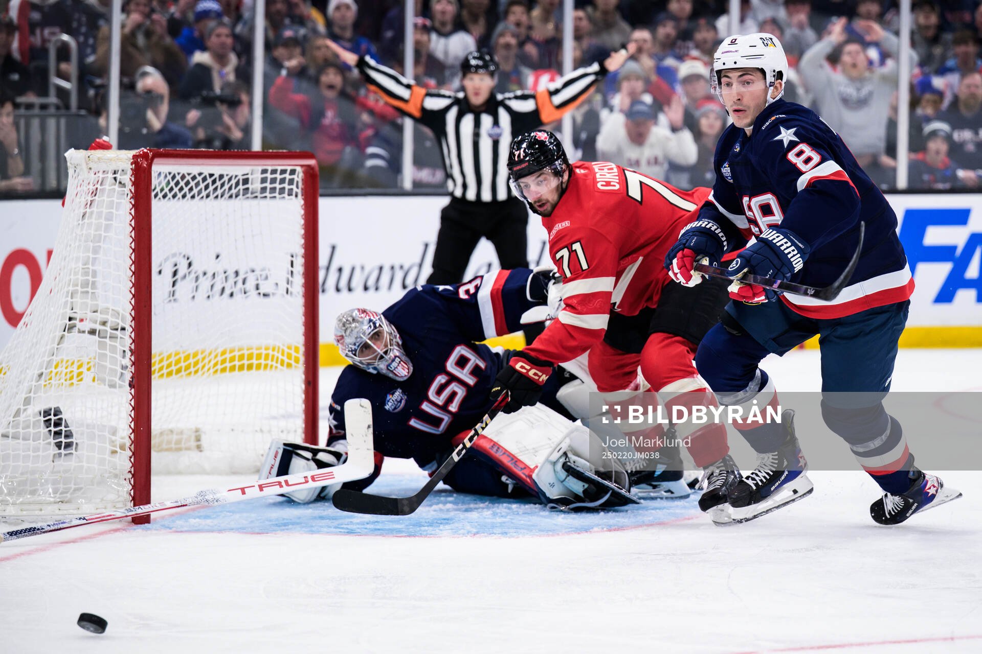 Goaltender Connor Hellebuyck and Zach Werenski of USA are
